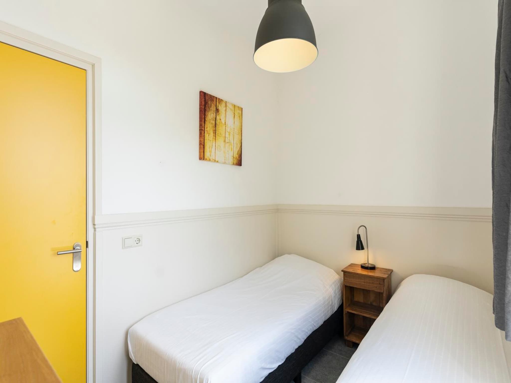 Een slaapkamer van Strandhuys Wulk in De Koog