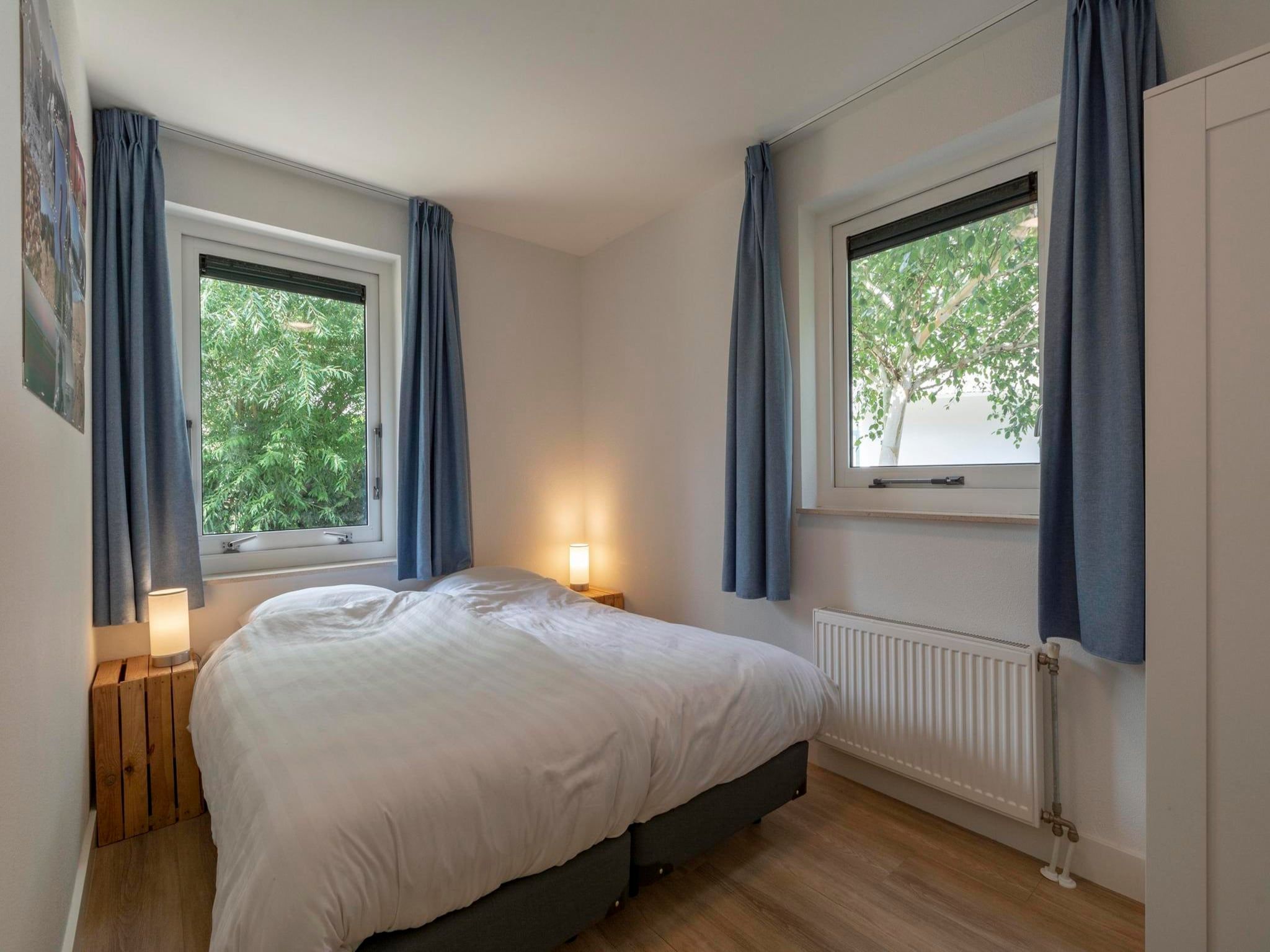 Een slaapkamer van Duynopgangh 16 in Julianadorp aan Zee
