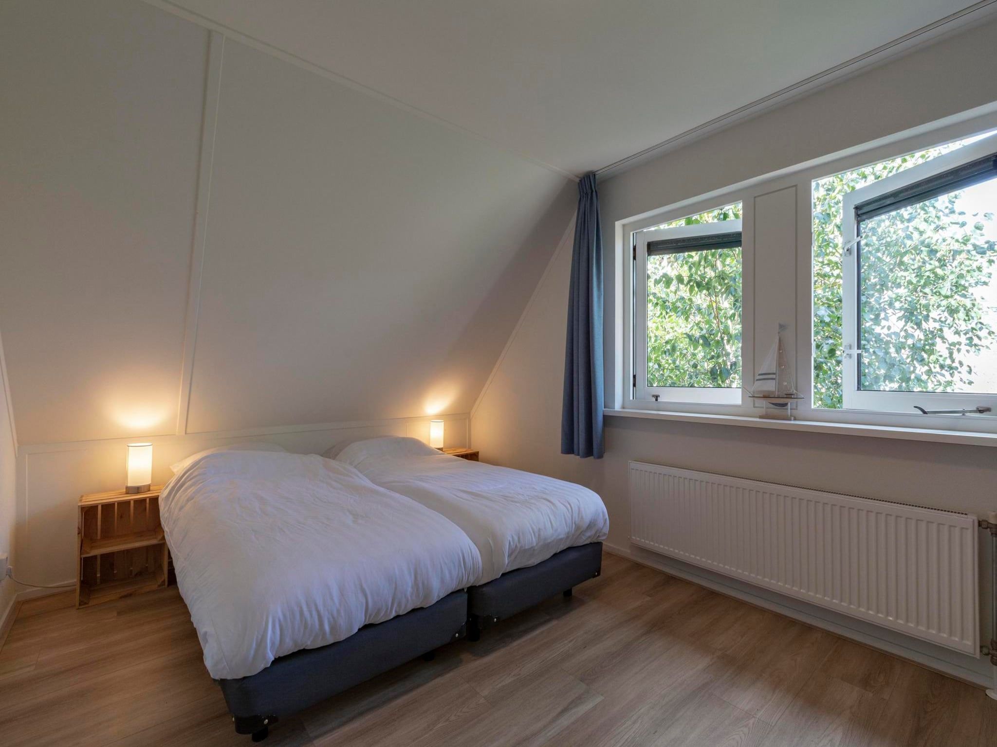 Een slaapkamer van Duynopgangh 16 in Julianadorp aan Zee