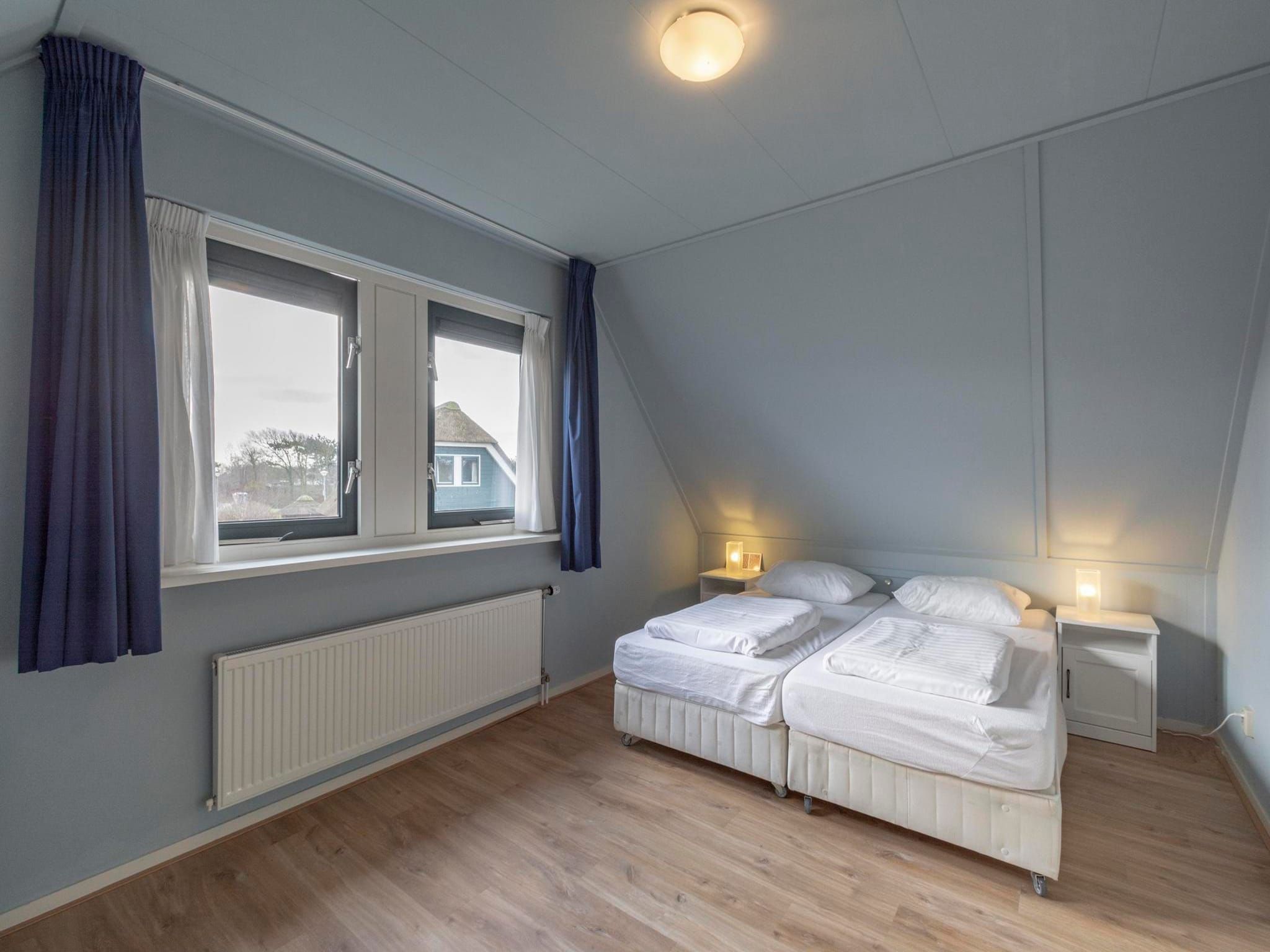 Een slaapkamer van Duynopgangh 46 in Julianadorp aan Zee