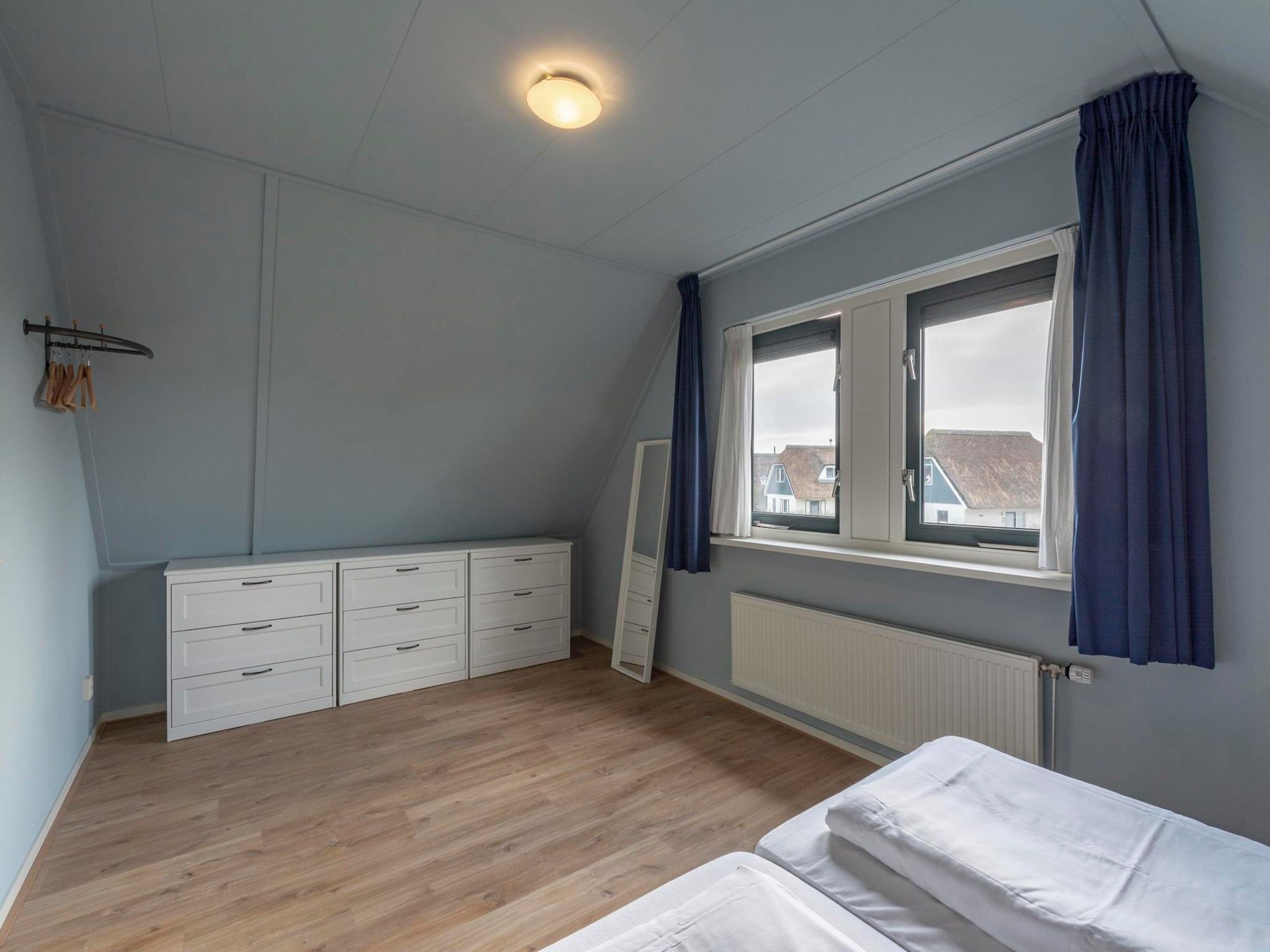 Een slaapkamer van Duynopgangh 46 in Julianadorp aan Zee