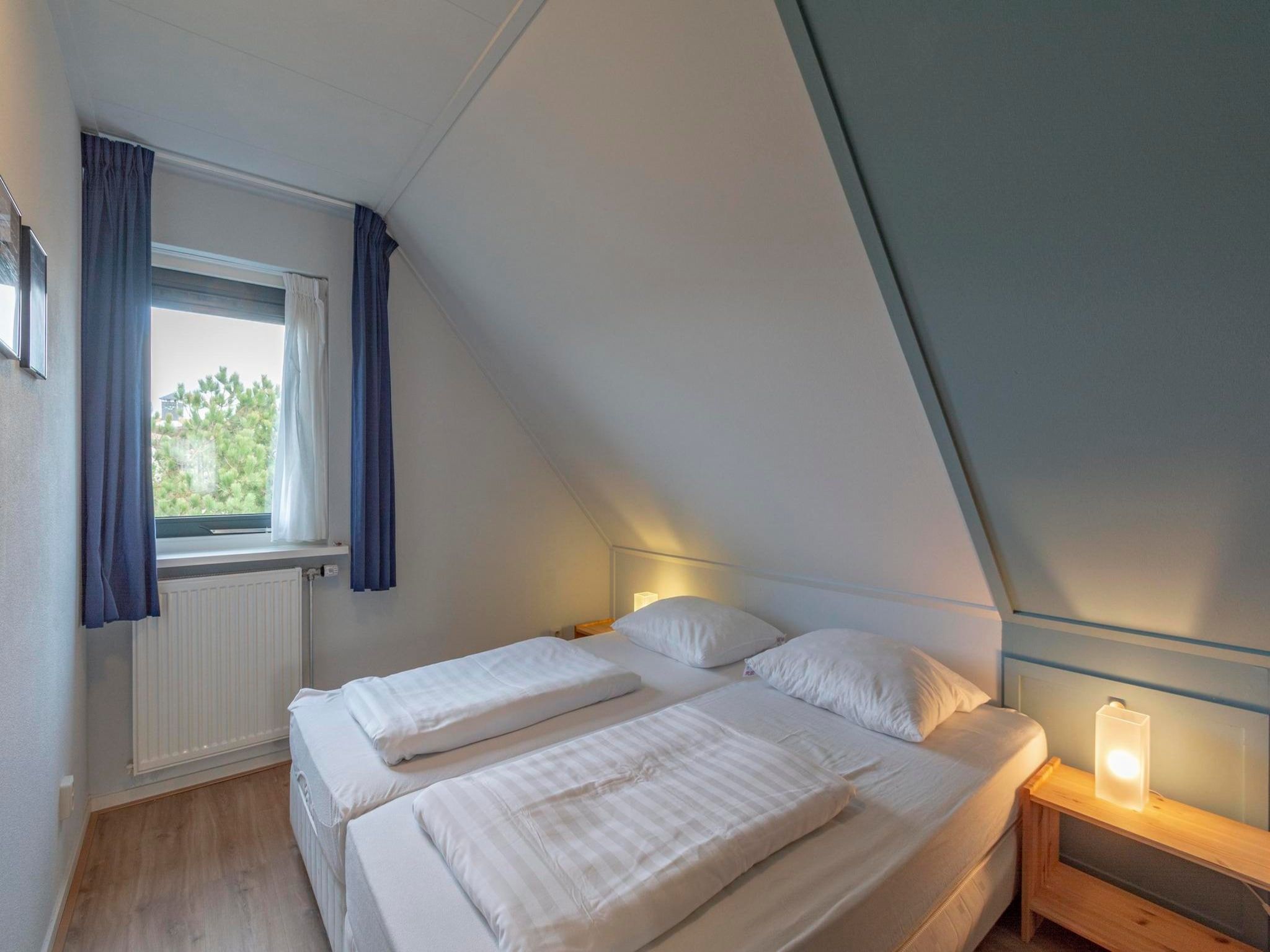 Een slaapkamer van Duynopgangh 46 in Julianadorp aan Zee