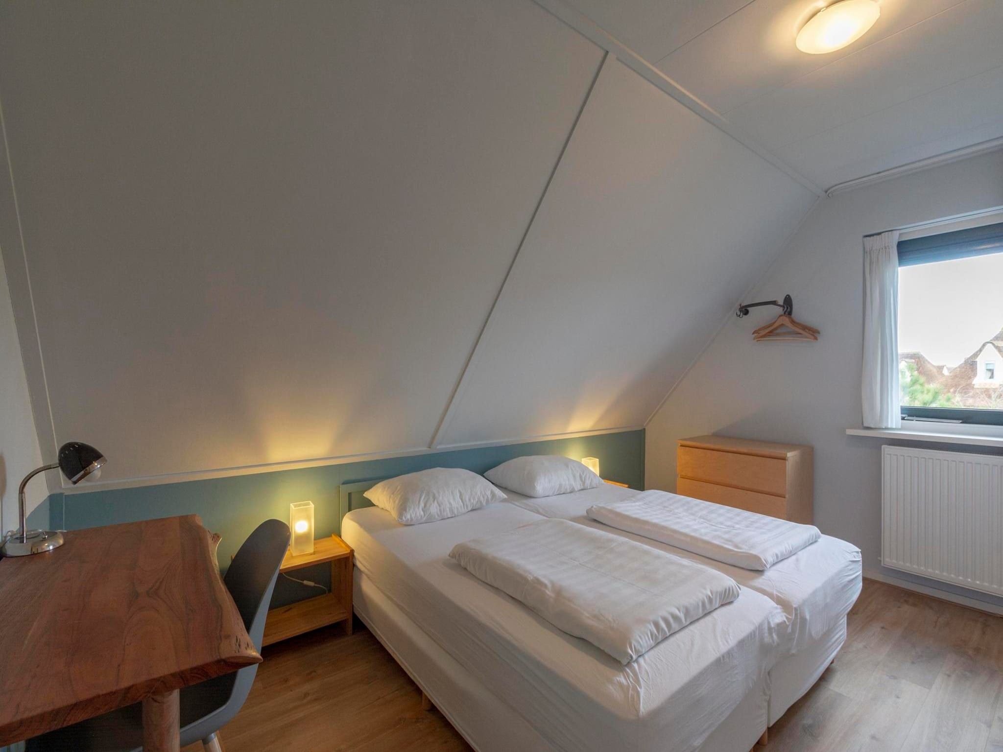 Een slaapkamer van Duynopgangh 46 in Julianadorp aan Zee