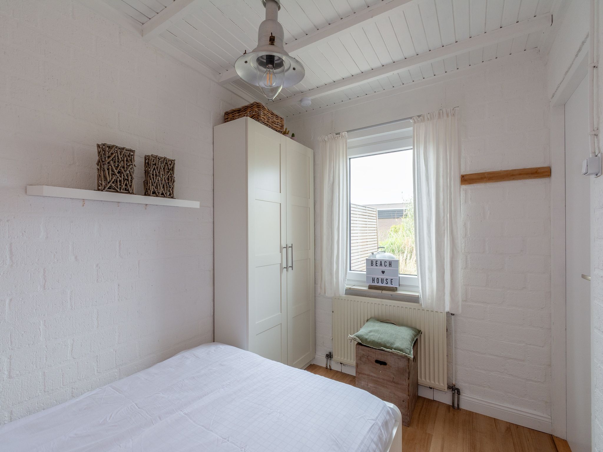 Een slaapkamer van De Blenck 3 in Callantsoog