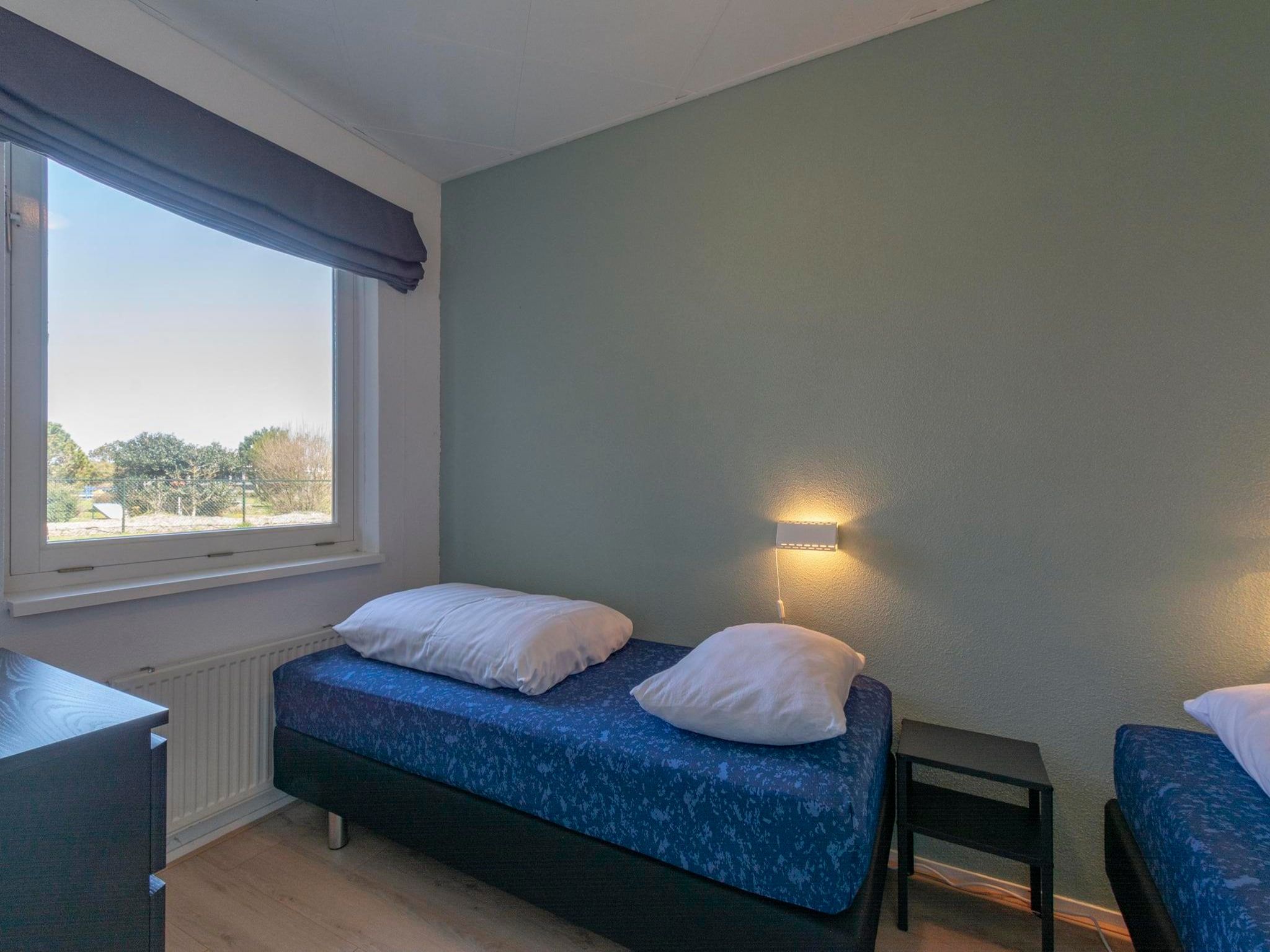 Een slaapkamer van Strandslag 95 in Julianadorp aan Zee