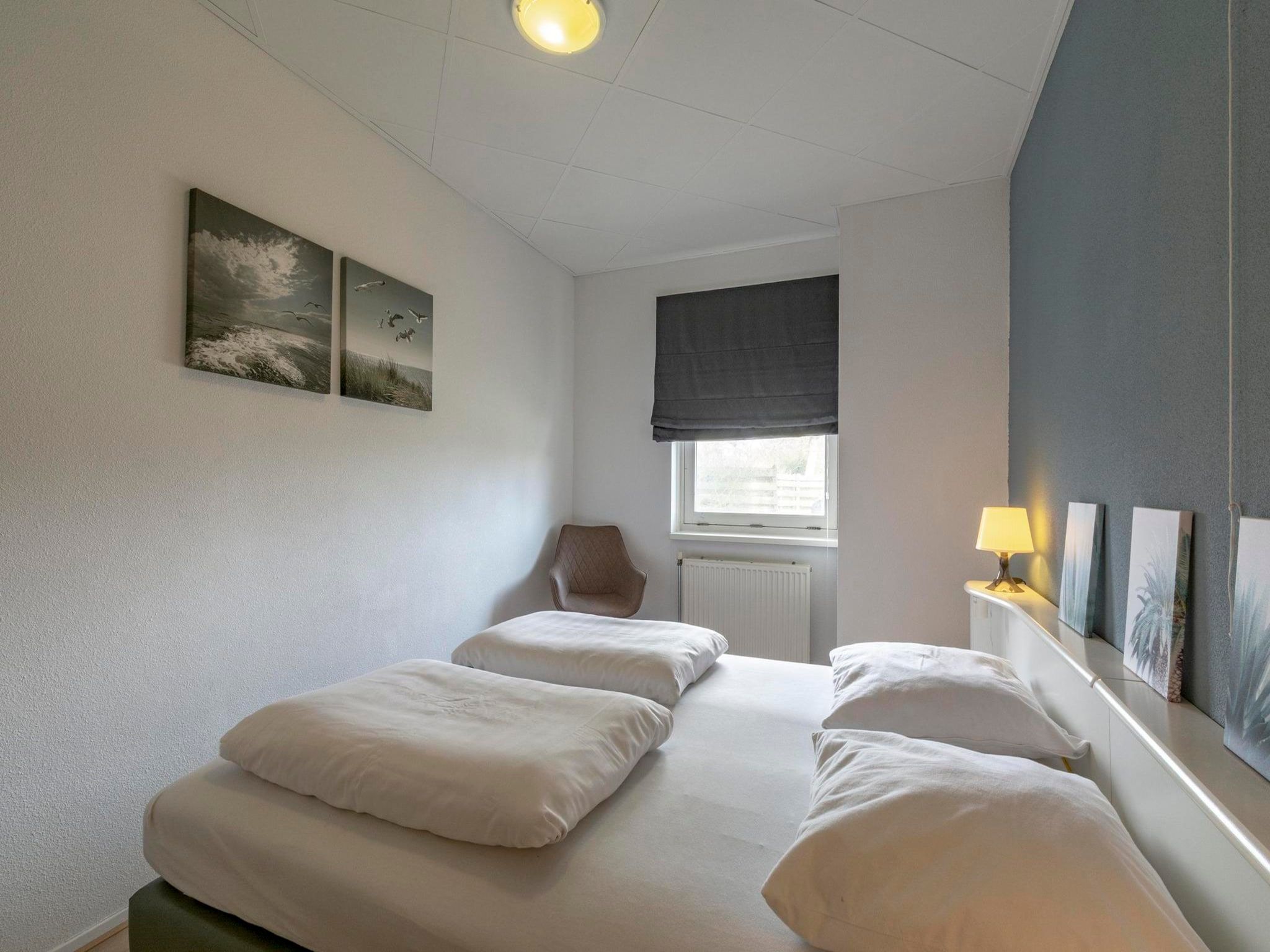 Een slaapkamer van Strandslag 95 in Julianadorp aan Zee