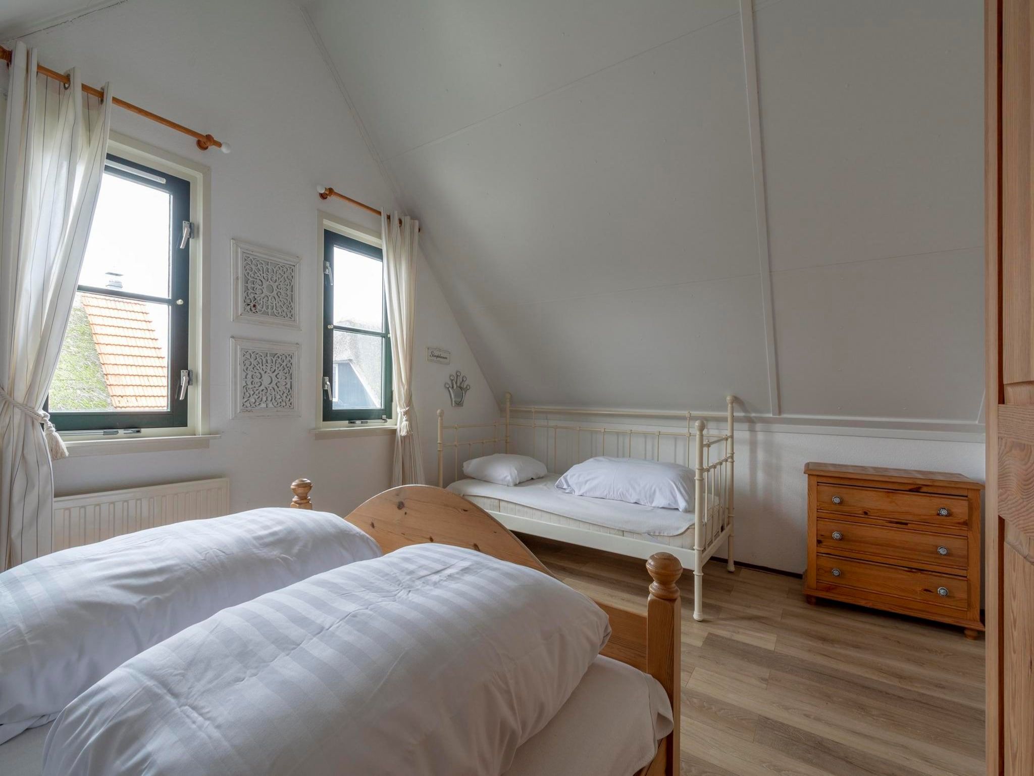 Een slaapkamer van De Buitenplaats 138 in Callantsoog