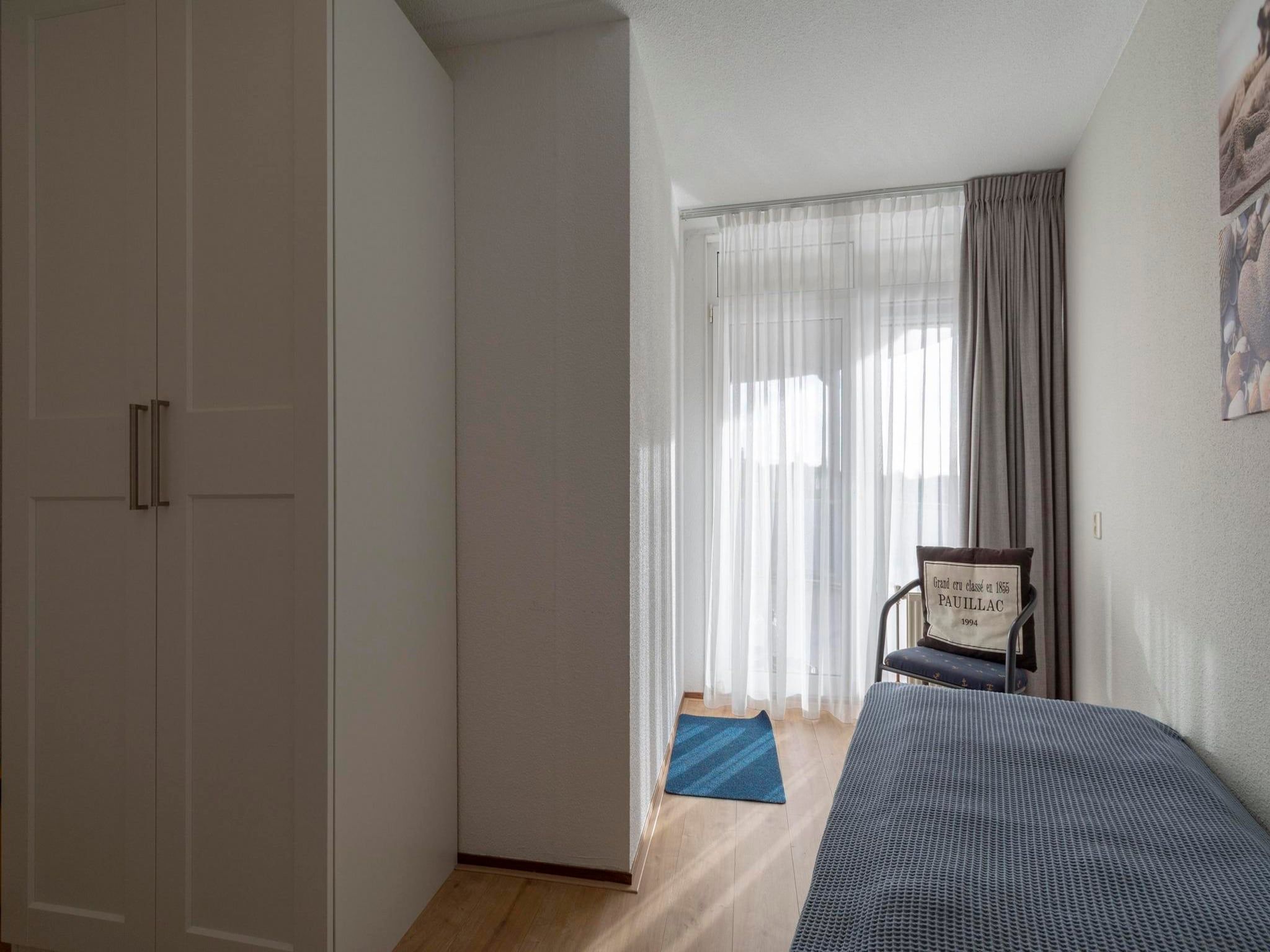 Een slaapkamer van Résidence Juliana 77 in Julianadorp aan Zee
