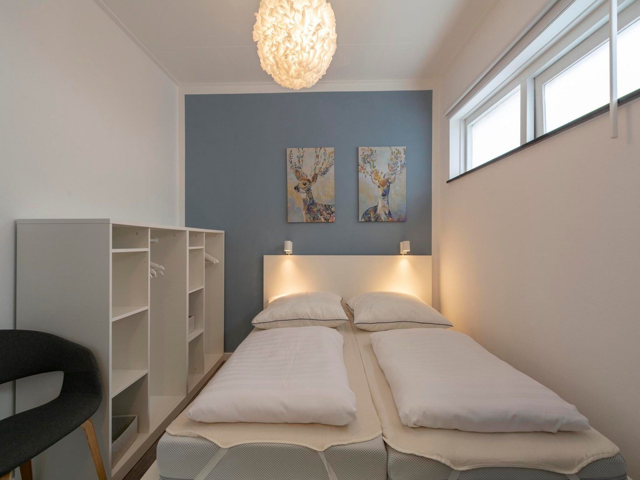 Een slaapkamer van Stuijvezandeweg 7-Z in Callantsoog