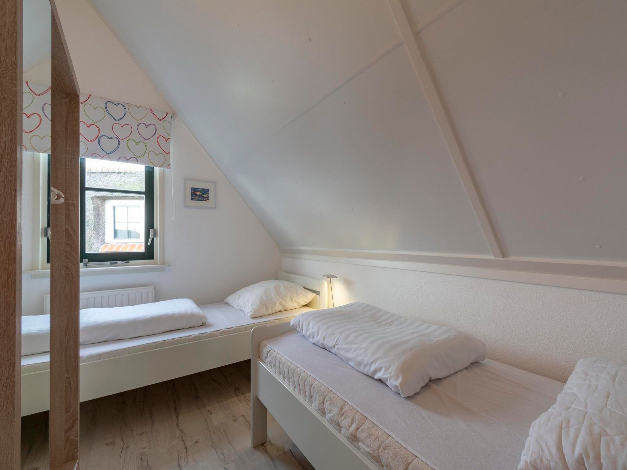 Een slaapkamer van De Buitenplaats 145 in Callantsoog