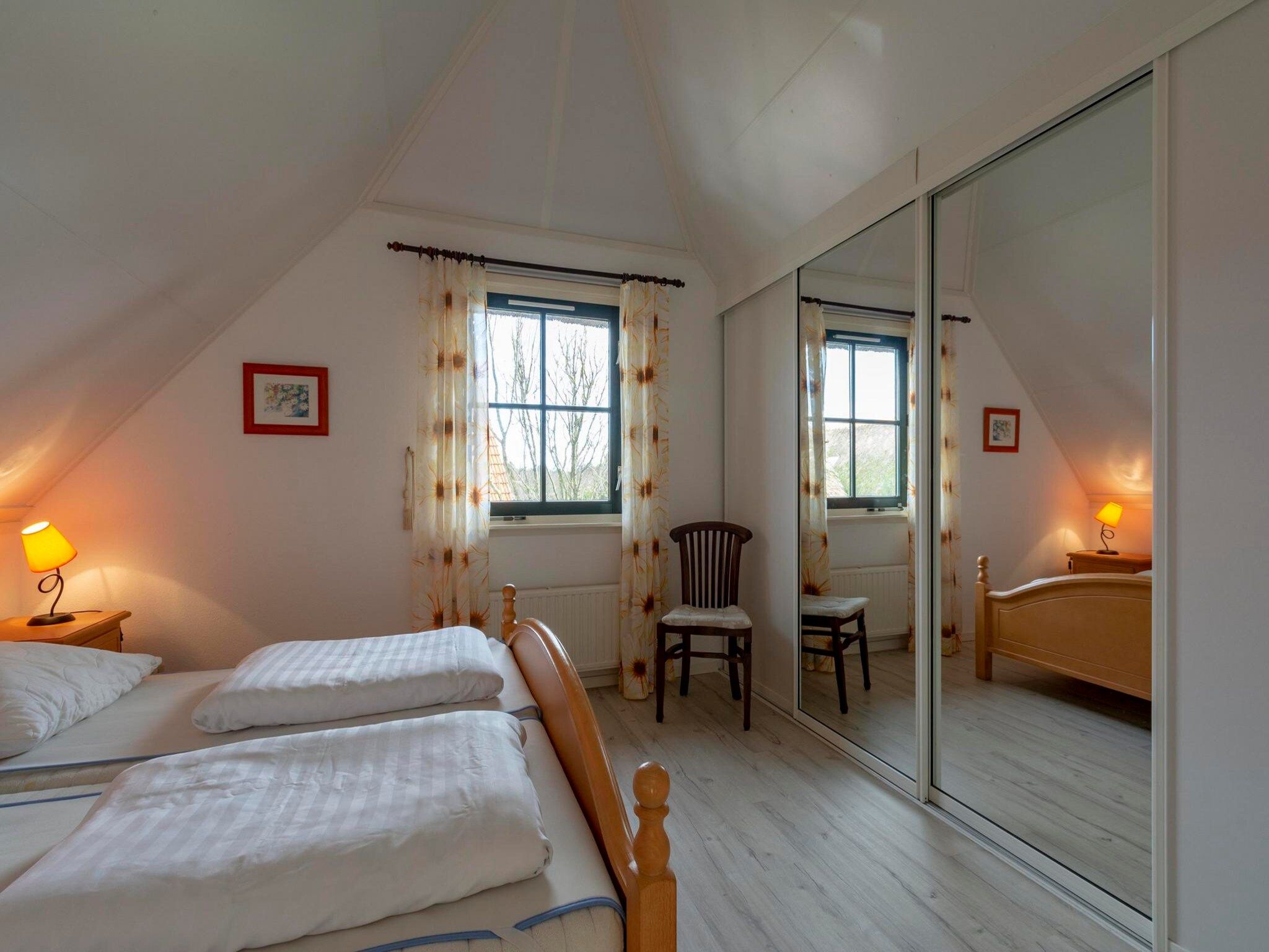 Een slaapkamer van De Buitenplaats 145 in Callantsoog