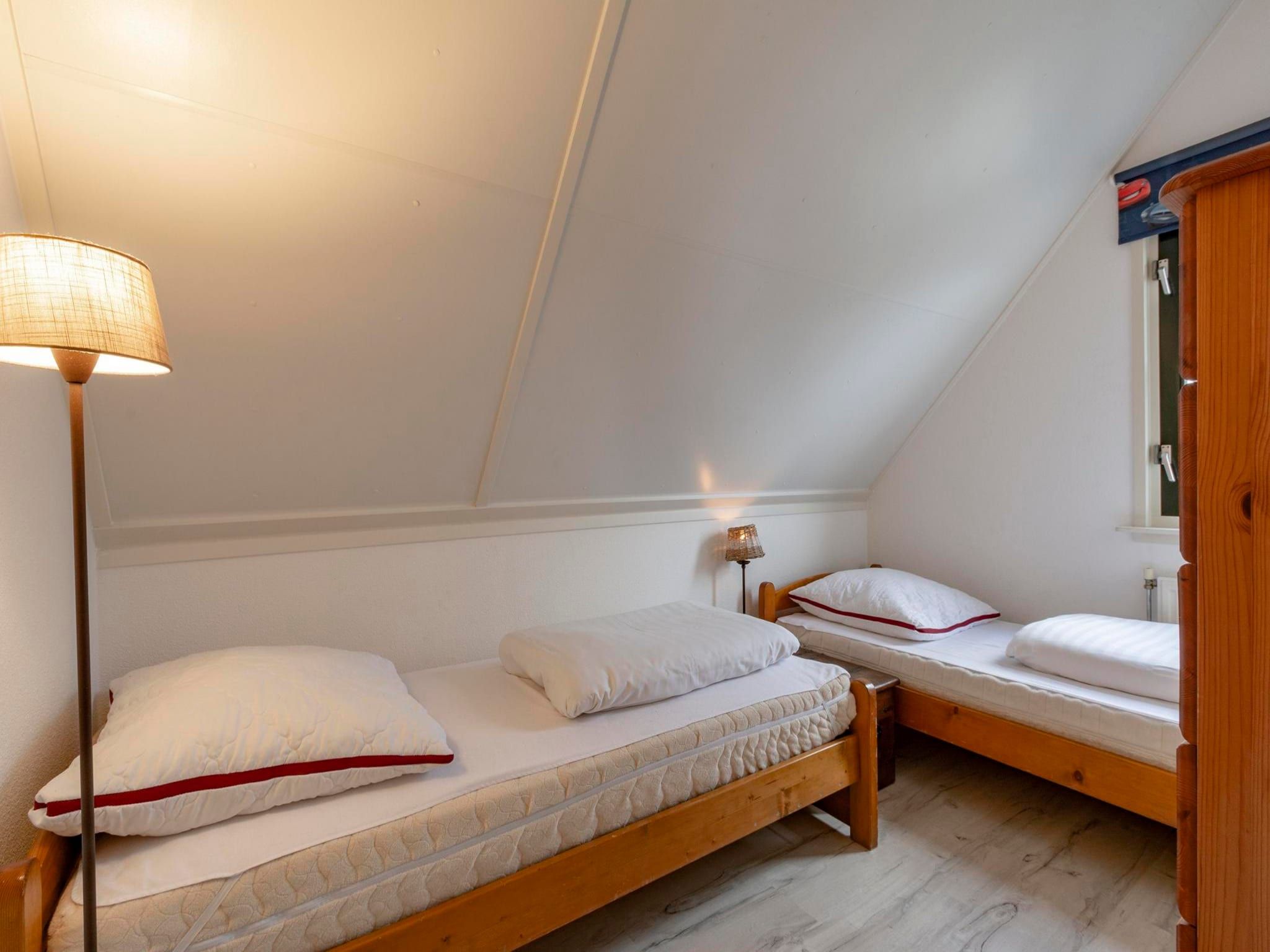 Een slaapkamer van De Buitenplaats 145 in Callantsoog