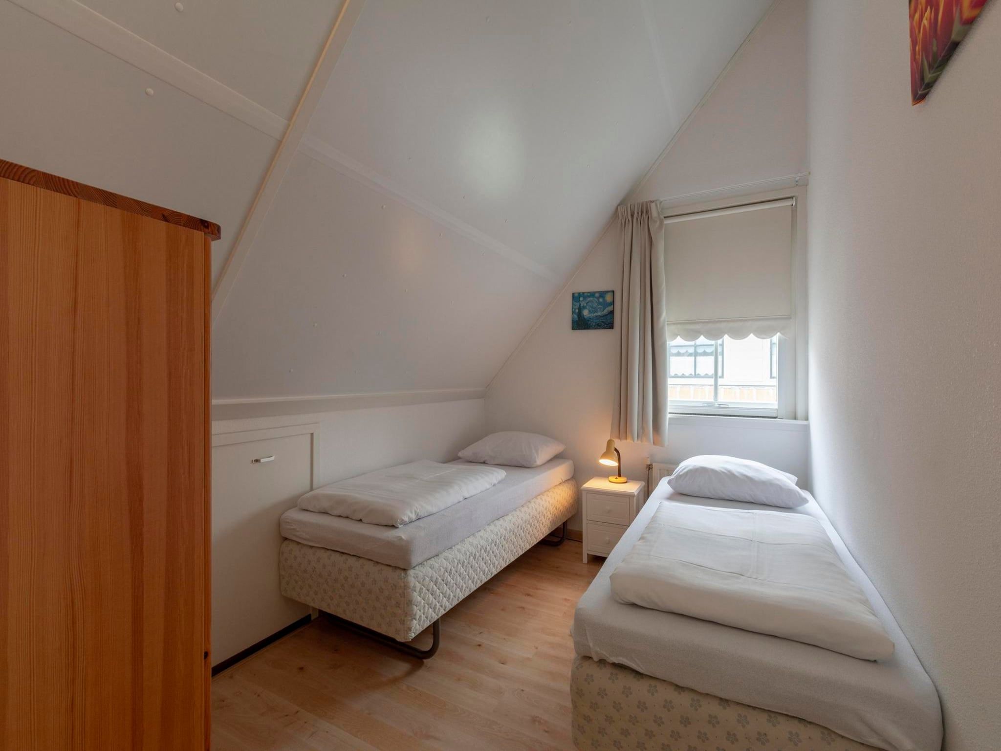 Een slaapkamer van De Buitenplaats 16 in Callantsoog