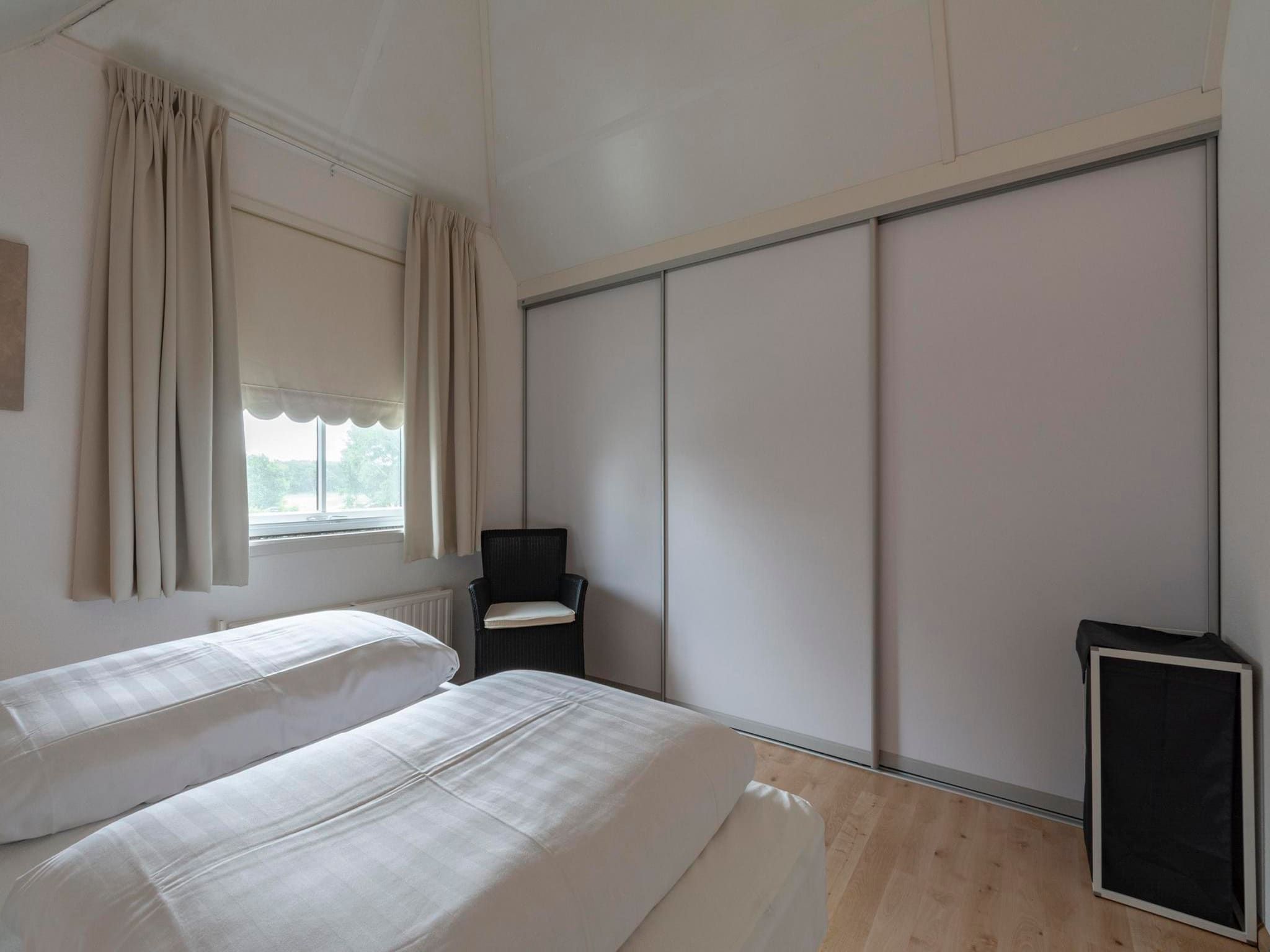 Een slaapkamer van De Buitenplaats 16 in Callantsoog