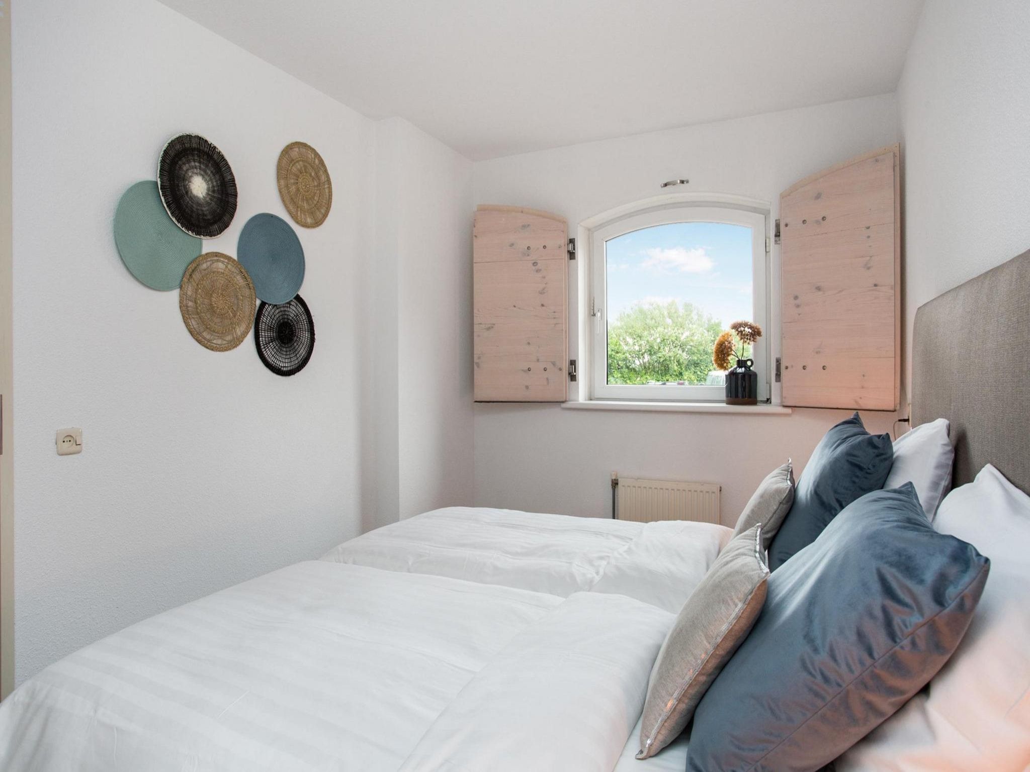 Een slaapkamer van Résidence Juliana 57 in Julianadorp aan Zee