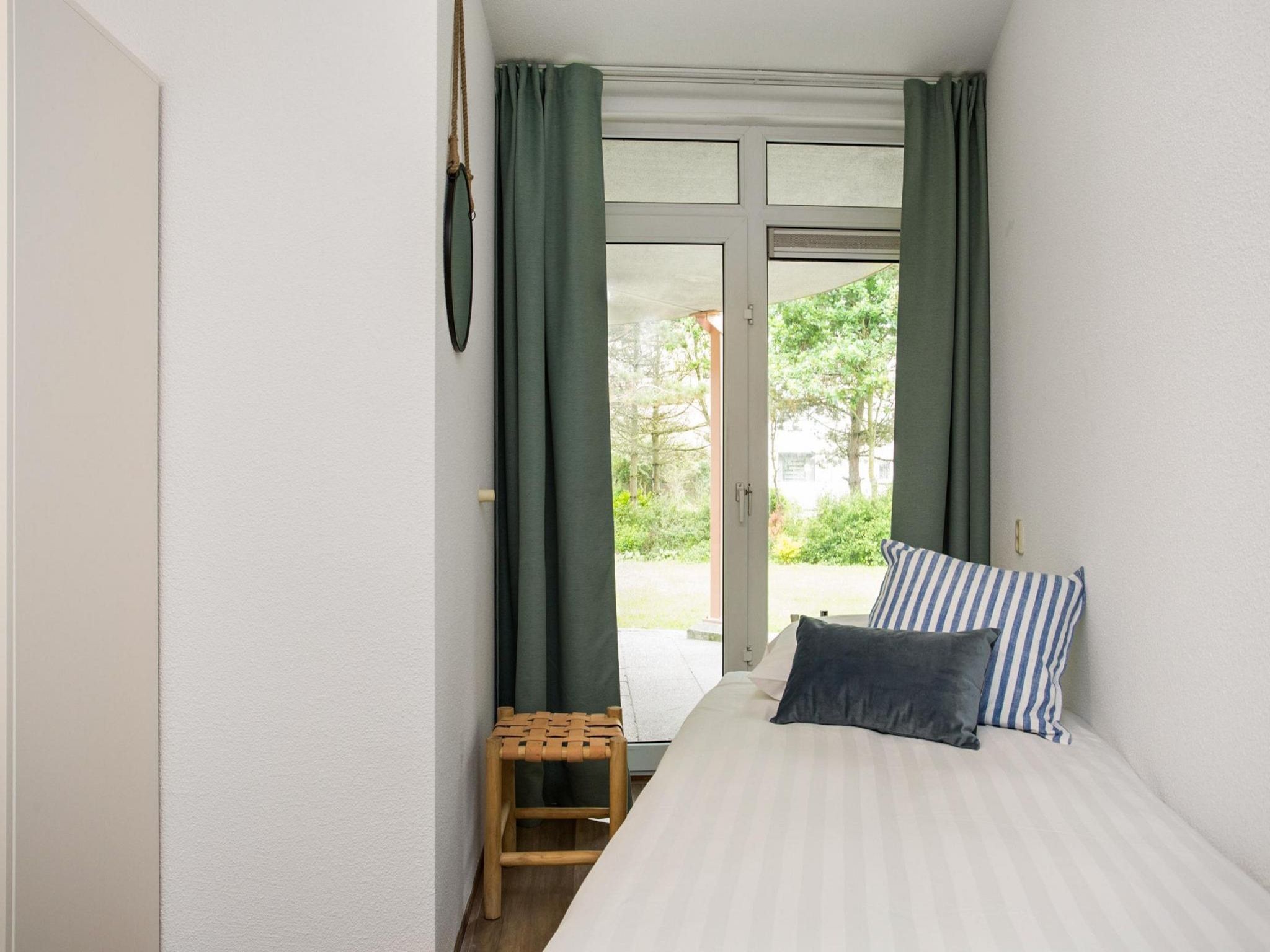 Een slaapkamer van Résidence Juliana 57 in Julianadorp aan Zee