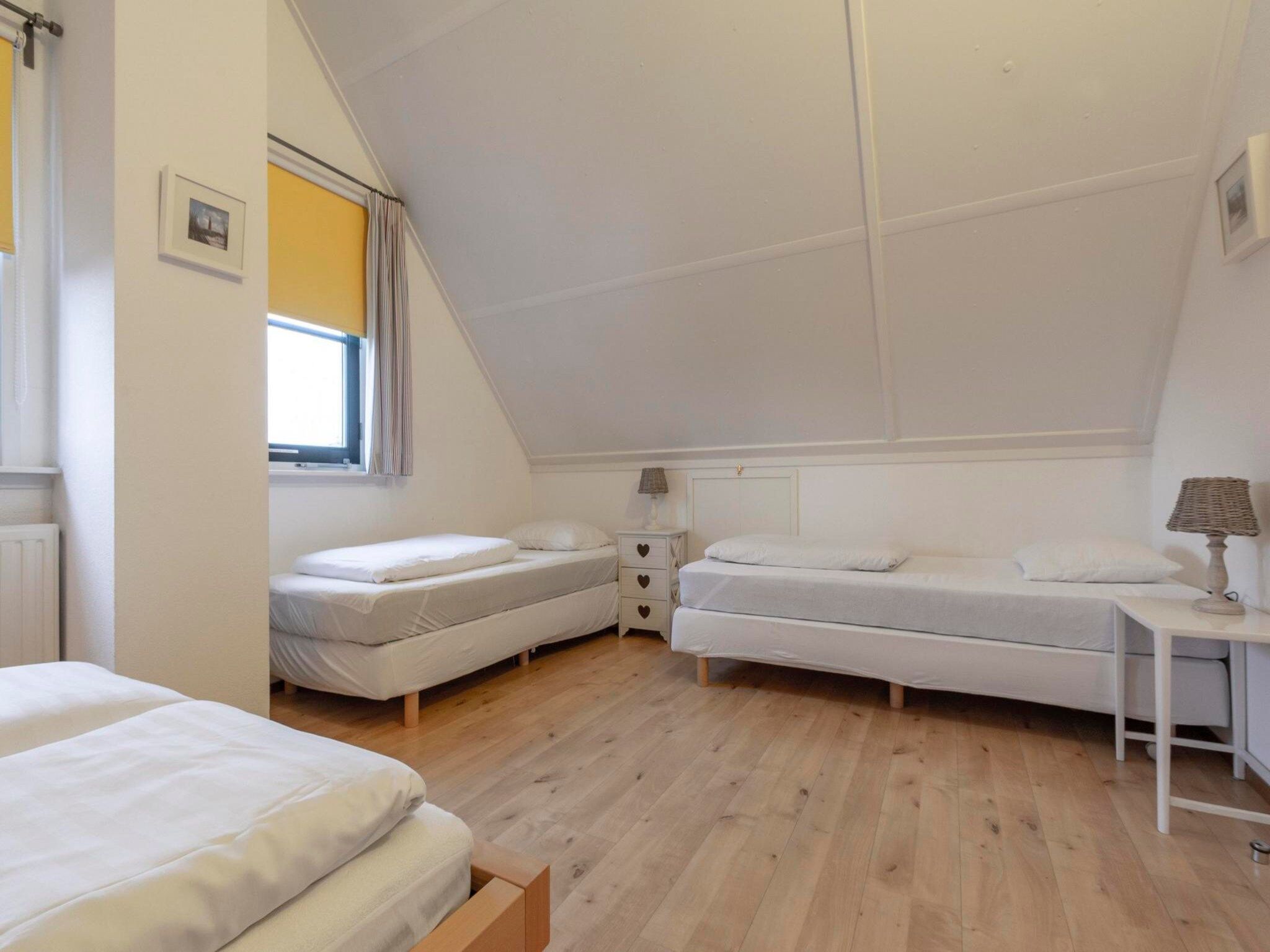 Een slaapkamer van De Buitenplaats 62 in Callantsoog