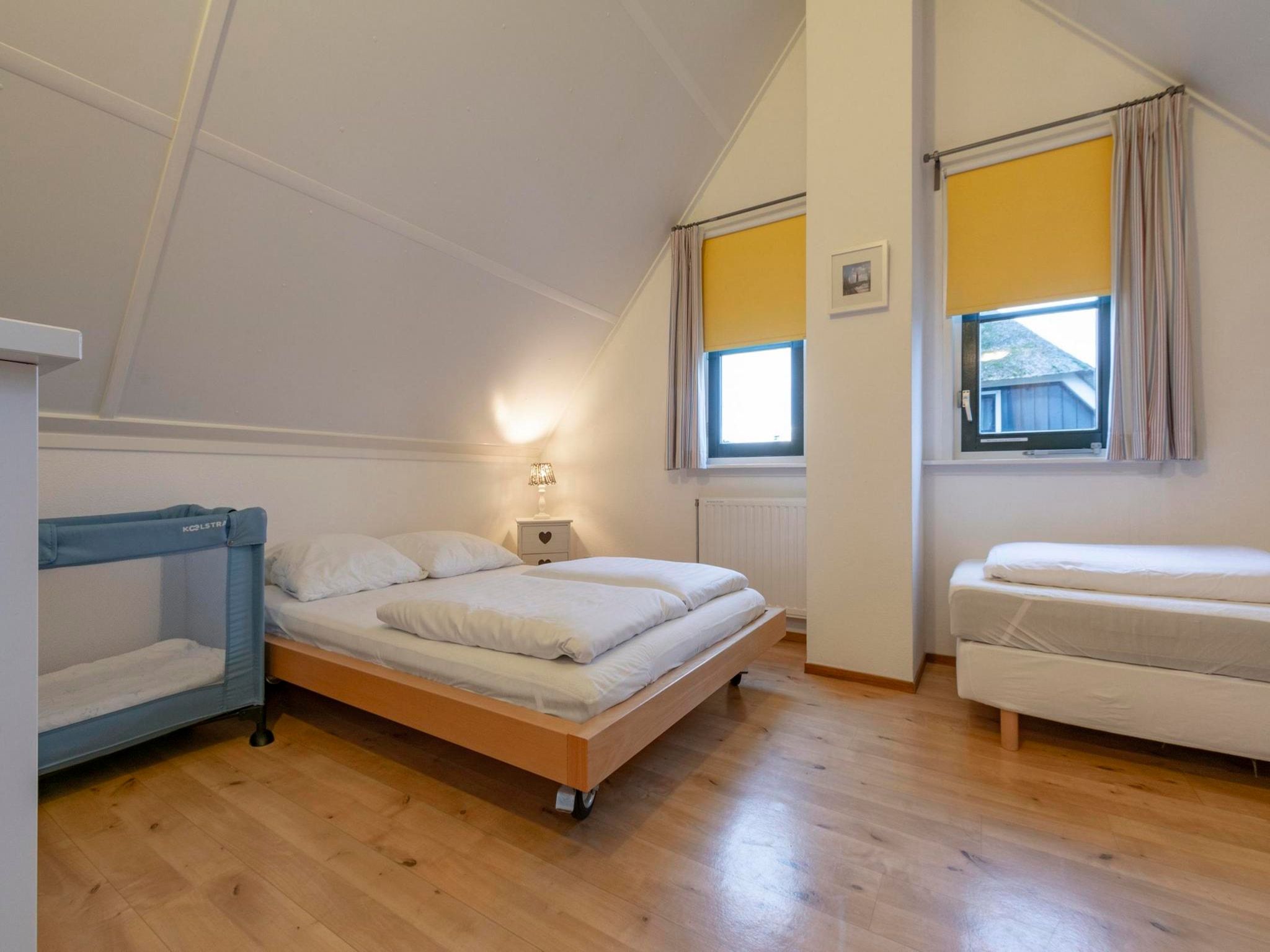 Een slaapkamer van De Buitenplaats 62 in Callantsoog