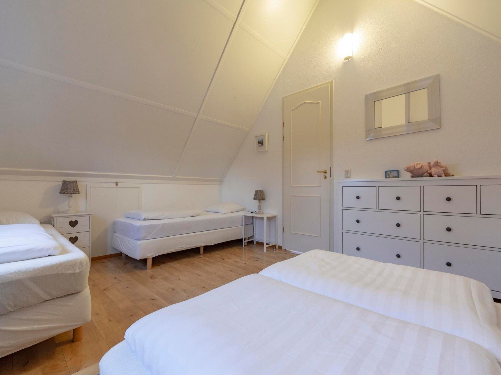 Een slaapkamer van De Buitenplaats 62 in Callantsoog