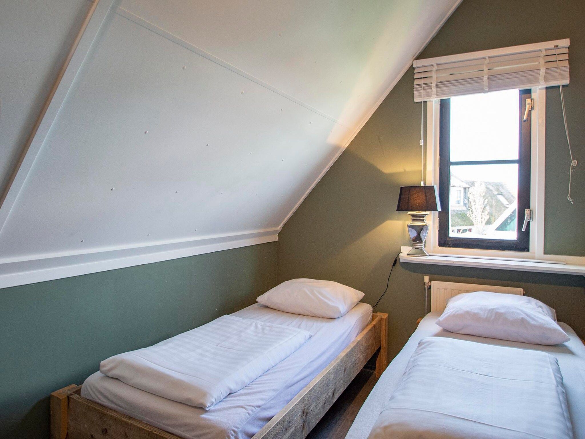 Een slaapkamer van De Buitenplaats 72 in Callantsoog