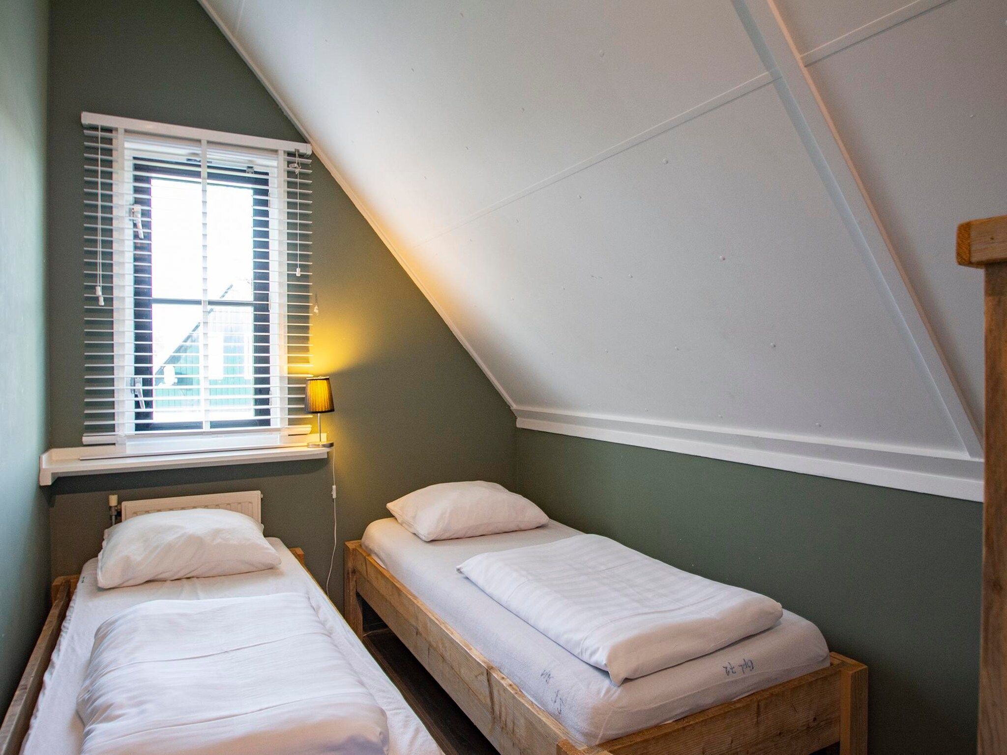 Een slaapkamer van De Buitenplaats 72 in Callantsoog