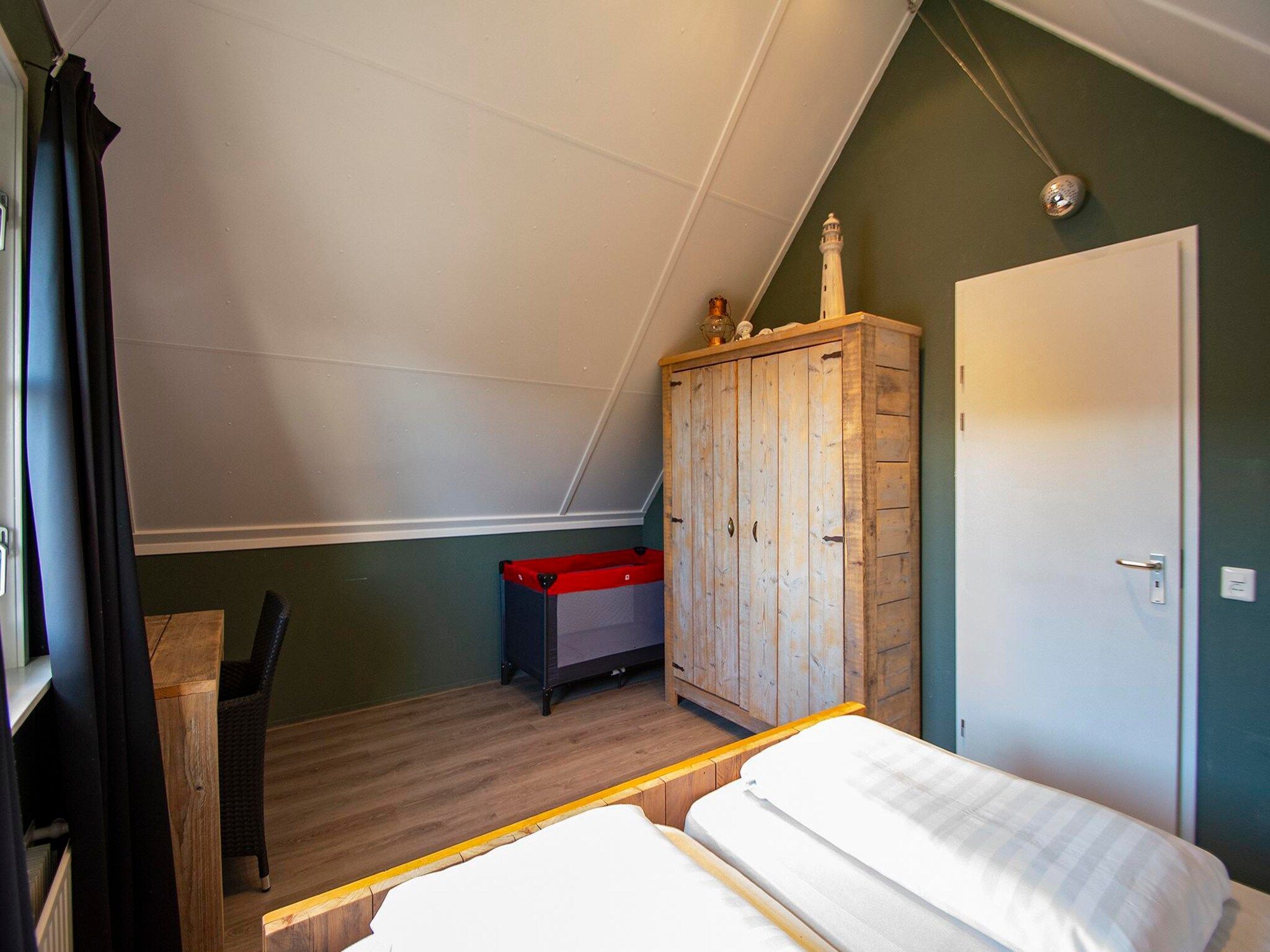 Een slaapkamer van De Buitenplaats 72 in Callantsoog
