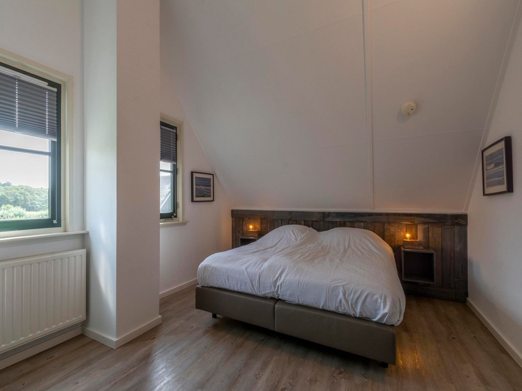 Een slaapkamer van De Buitenplaats 89 in Callantsoog