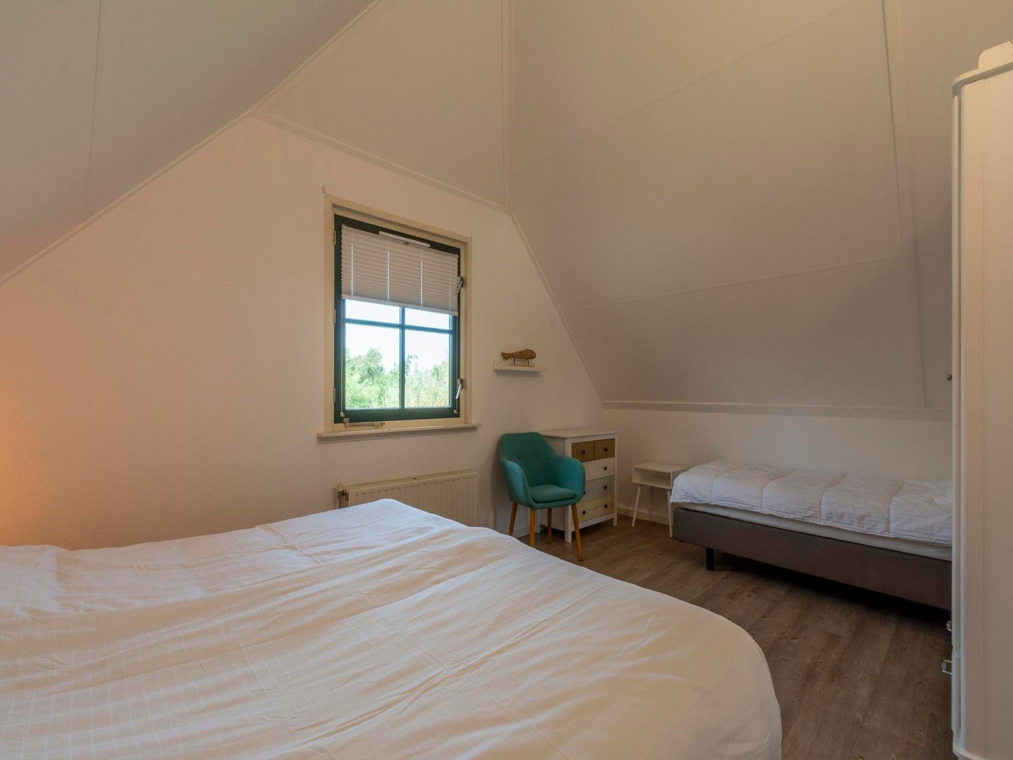 Een slaapkamer van De Buitenplaats 89 in Callantsoog