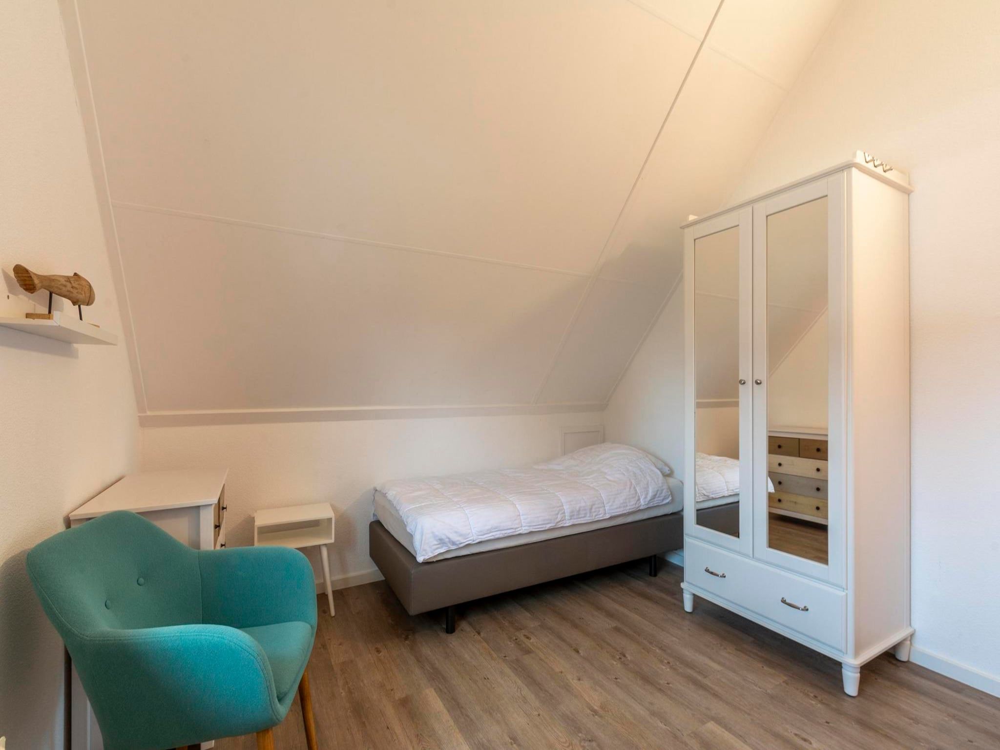 Een slaapkamer van De Buitenplaats 89 in Callantsoog