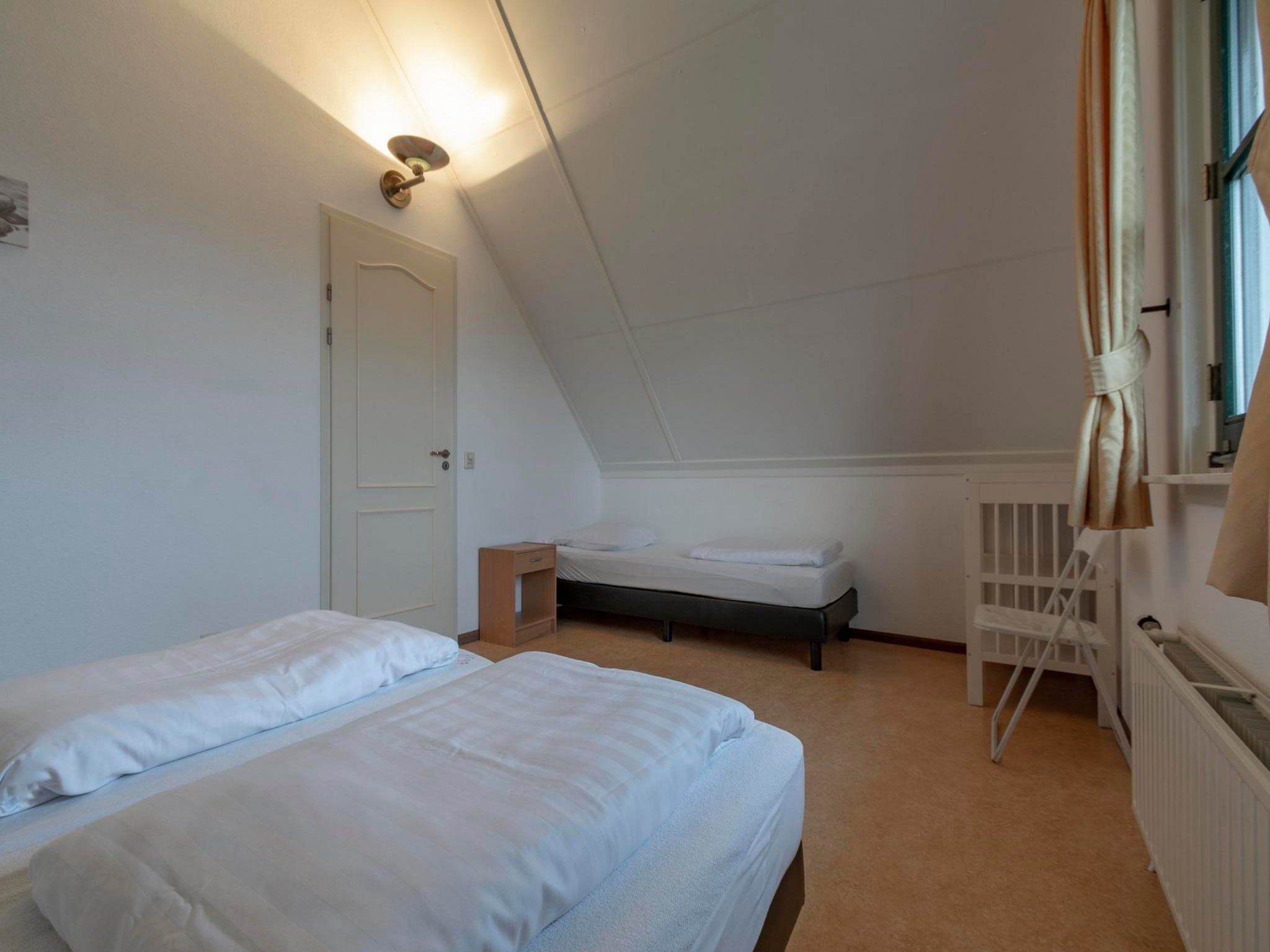 Een slaapkamer van De Buitenplaats 97 in Callantsoog
