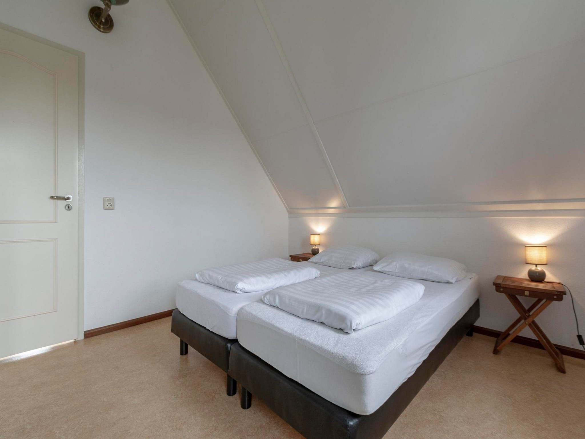 Een slaapkamer van De Buitenplaats 97 in Callantsoog