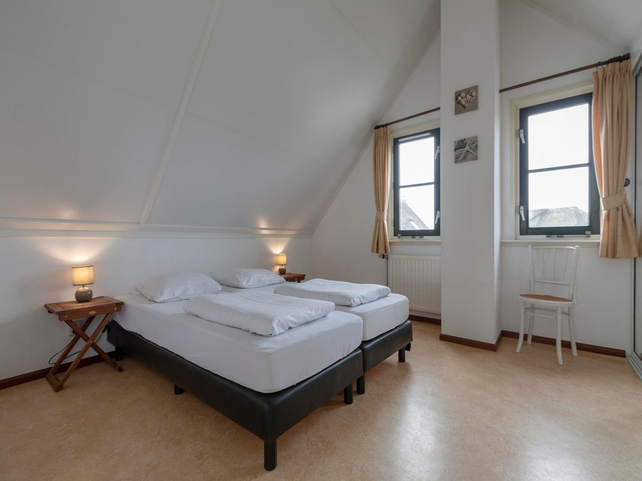 Een slaapkamer van De Buitenplaats 97 in Callantsoog
