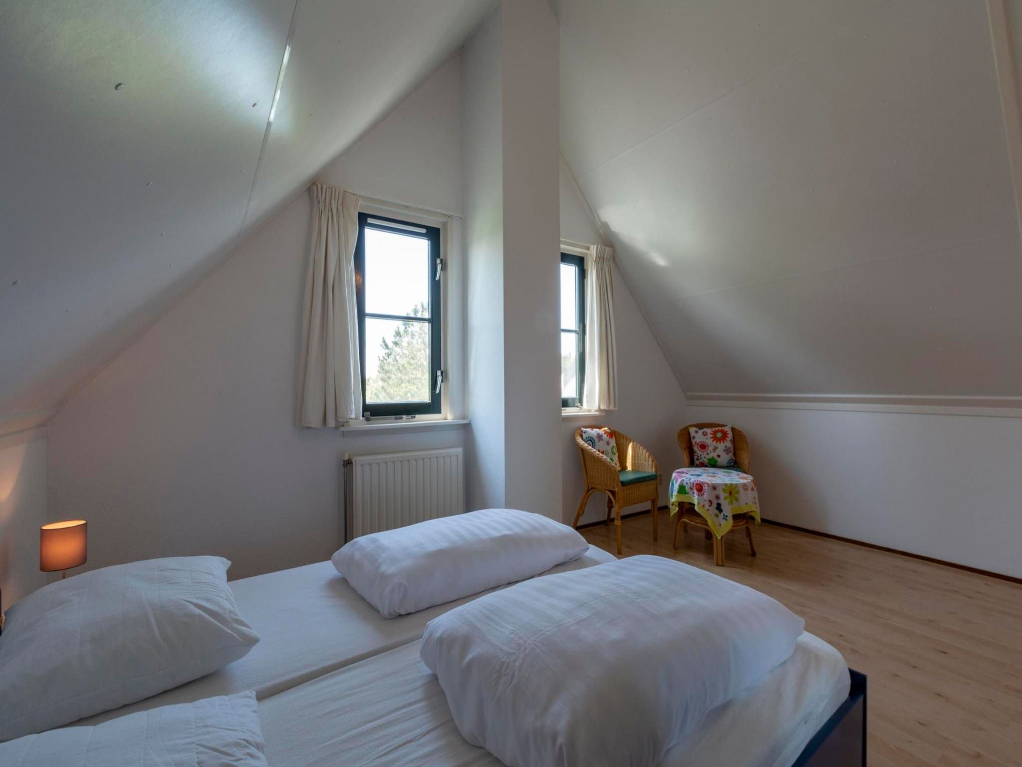 Een slaapkamer van De Buitenplaats 98 in Callantsoog