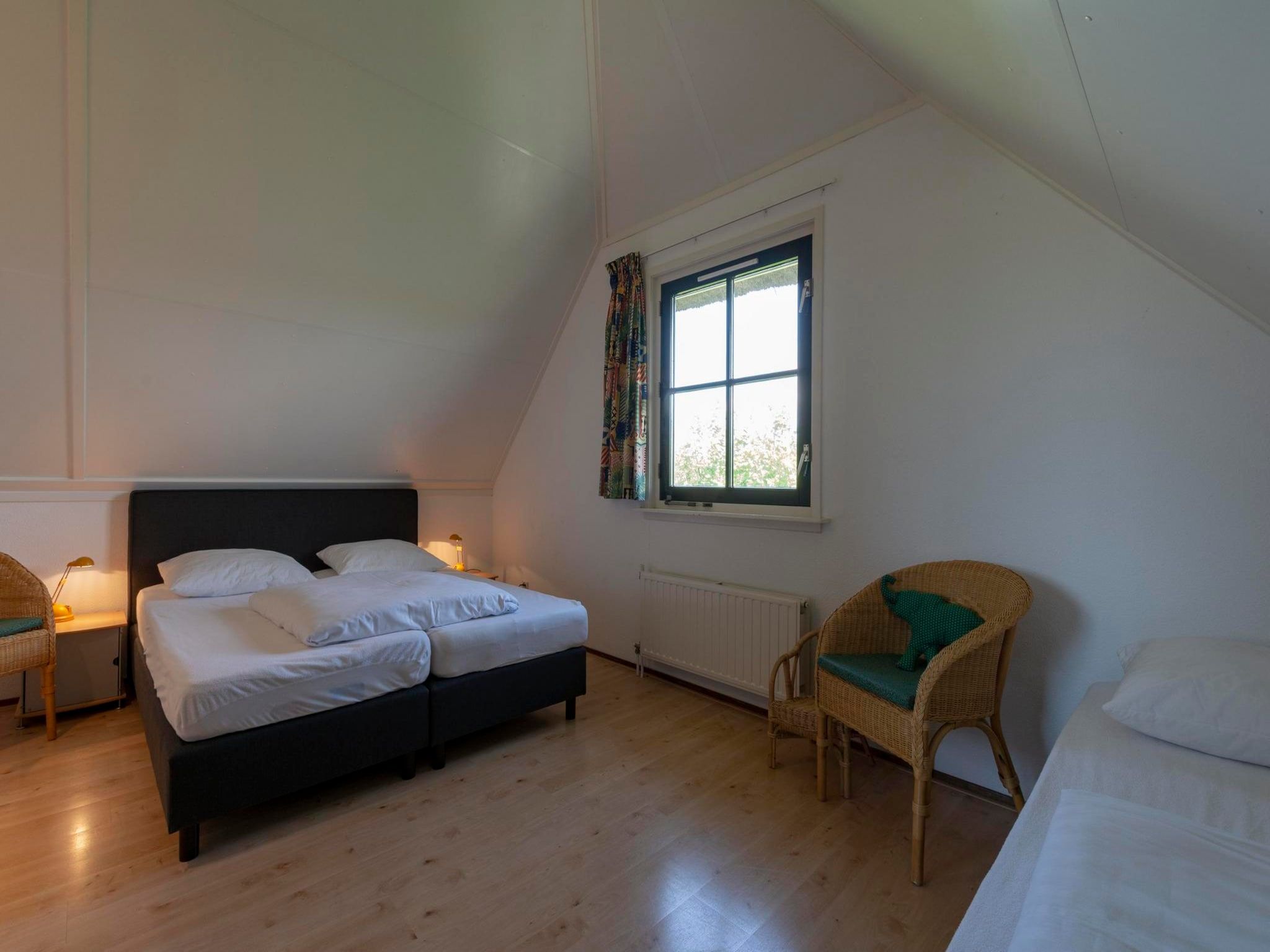 Een slaapkamer van De Buitenplaats 98 in Callantsoog