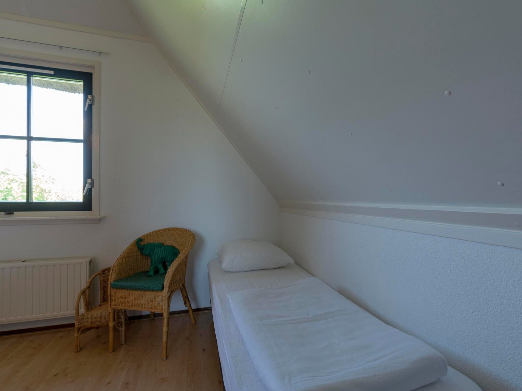 Een slaapkamer van De Buitenplaats 98 in Callantsoog