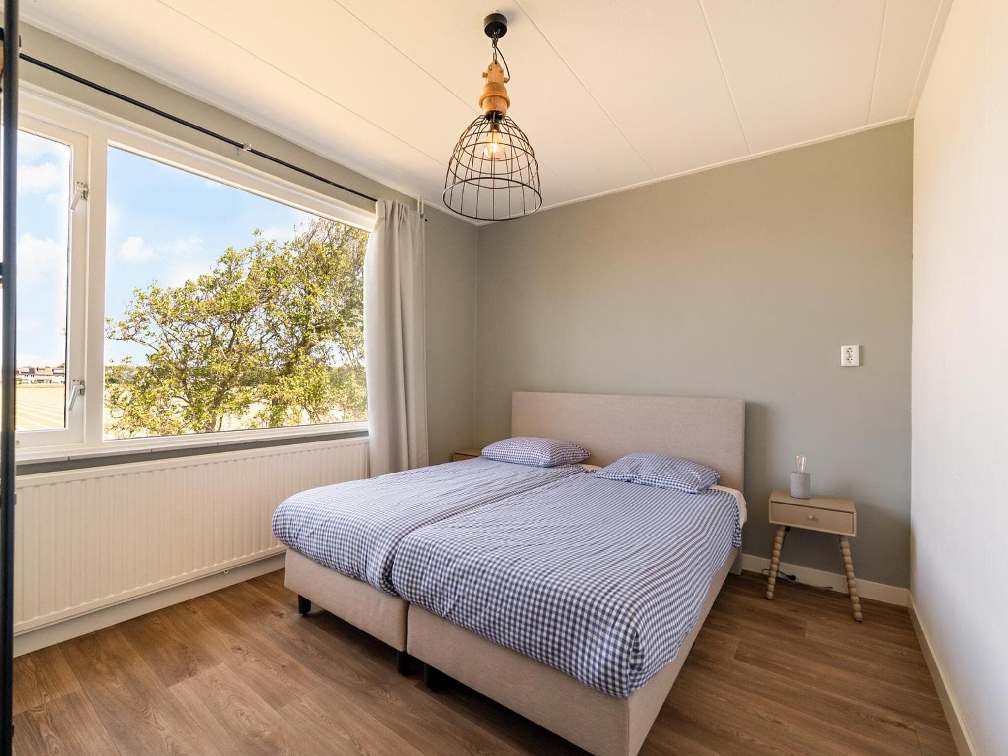 Een slaapkamer van Villa Zuidwester in Callantsoog