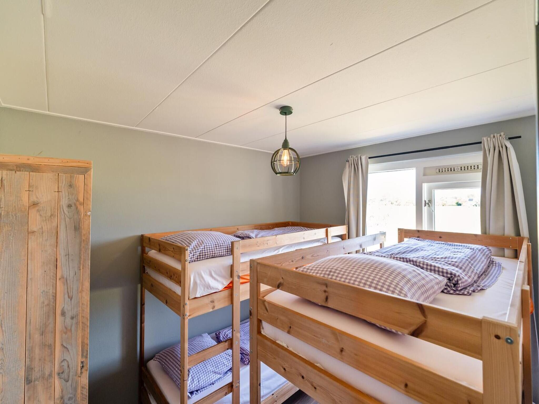 Een slaapkamer van Villa Zuidwester in Callantsoog