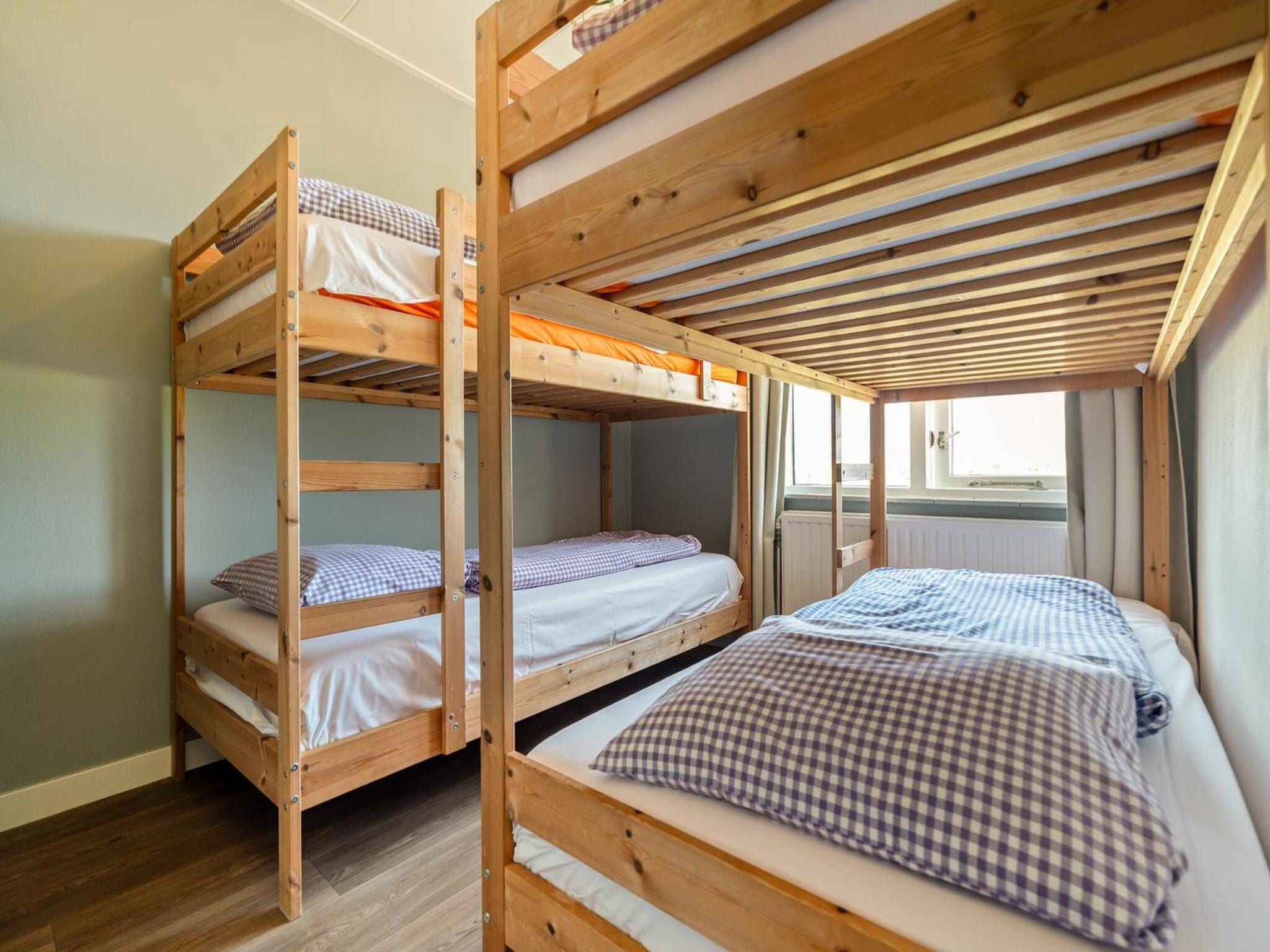Een slaapkamer van Villa Zuidwester in Callantsoog