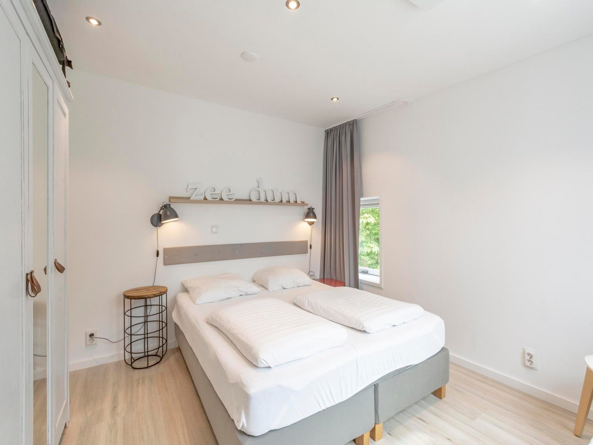Een slaapkamer van Duinland 126 Kleine Mia in Sint Maartenszee