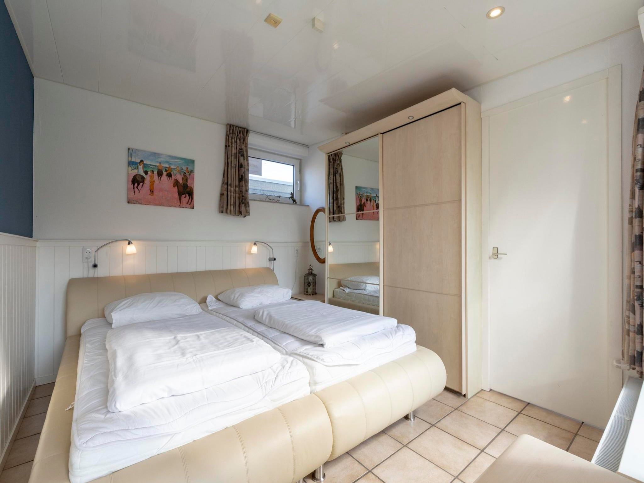 Een slaapkamer van Duinland 183 in Sint Maartenszee