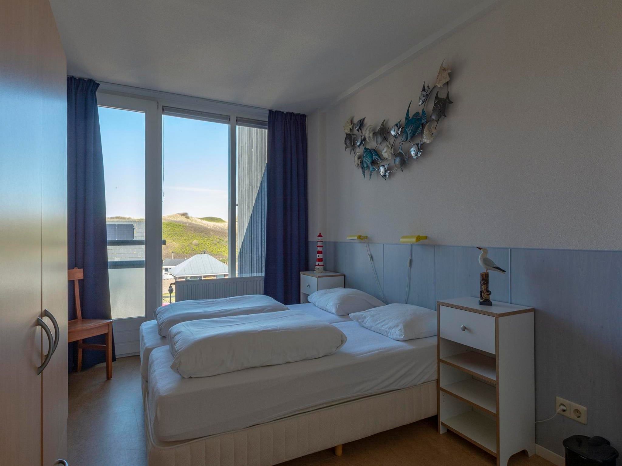 Een slaapkamer van Dorpsplein 23E in Callantsoog