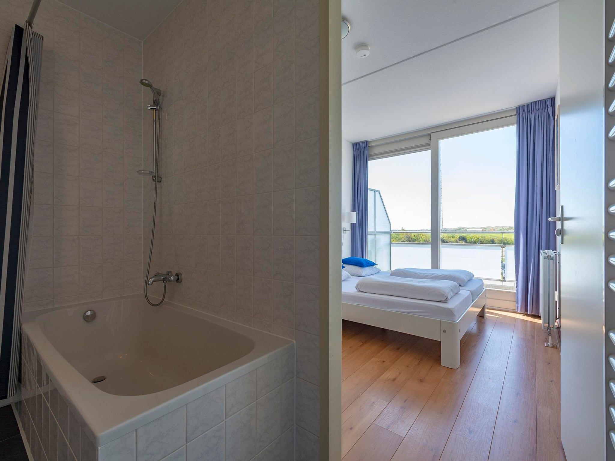 Een slaapkamer van Duinerei A202 in Groote Keeten