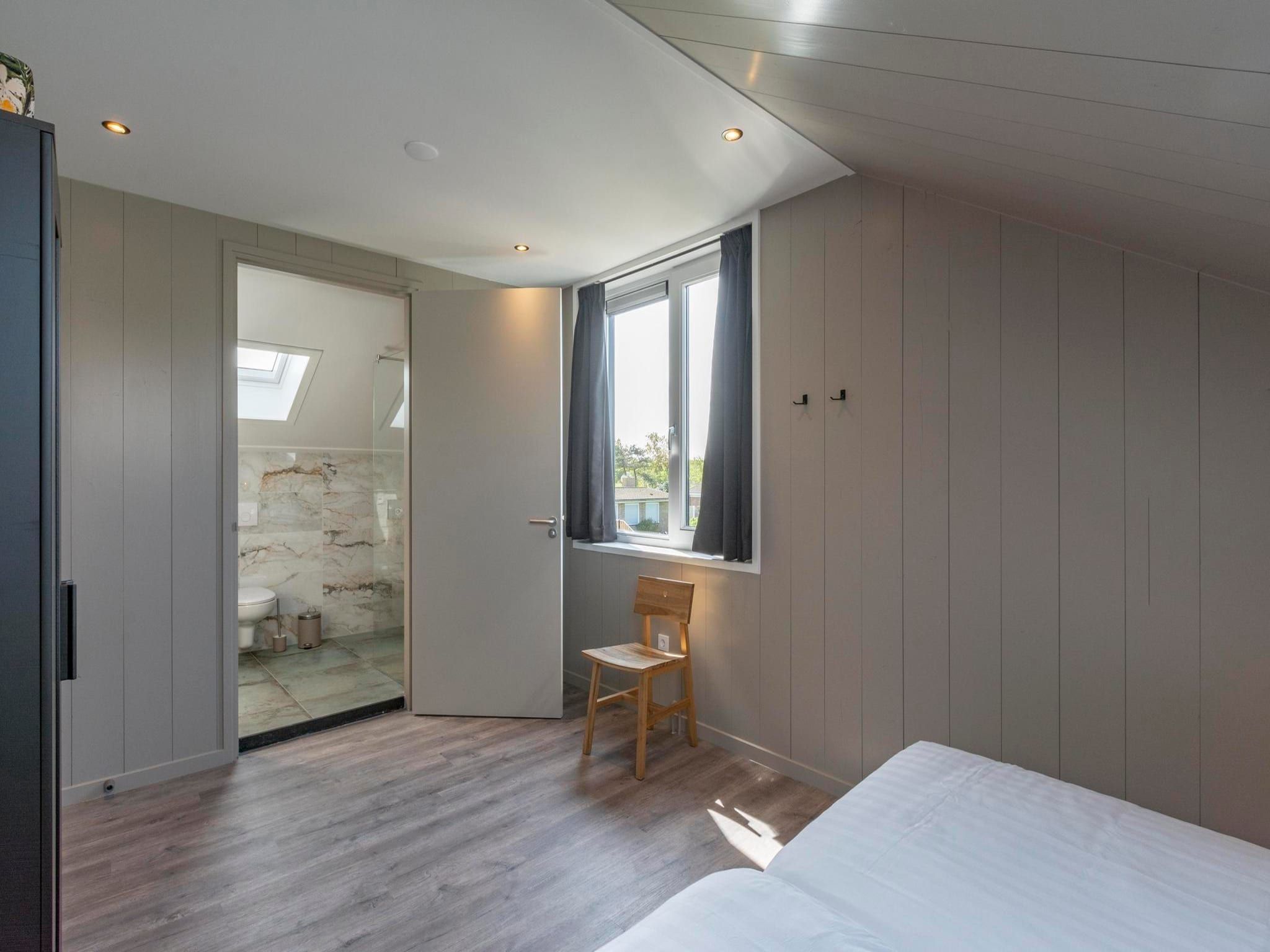 Een slaapkamer van Wellness Villa Lotje in Julianadorp aan Zee