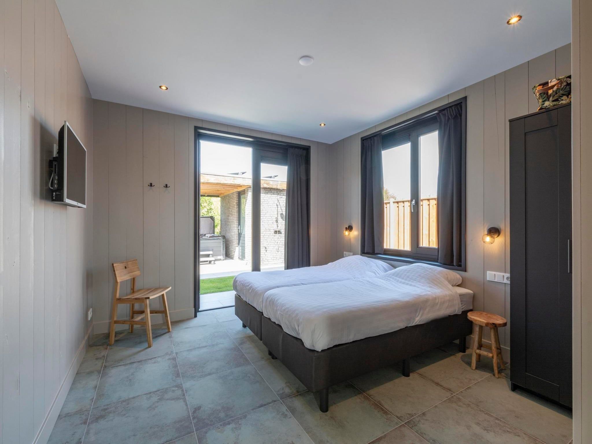 Een slaapkamer van Wellness Villa Lotje in Julianadorp aan Zee