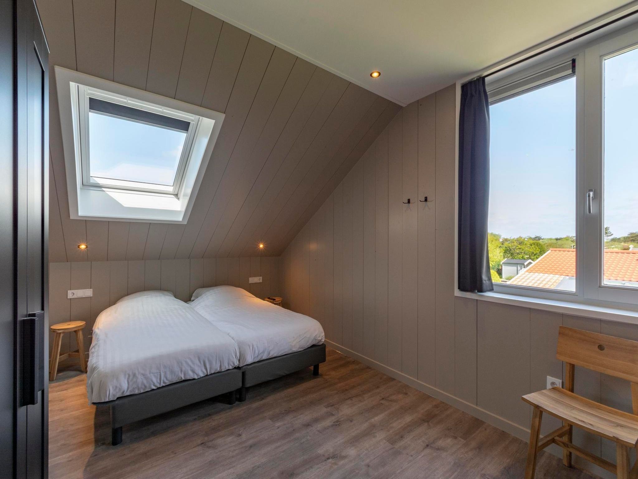 Een slaapkamer van Wellness Villa Lotje in Julianadorp aan Zee