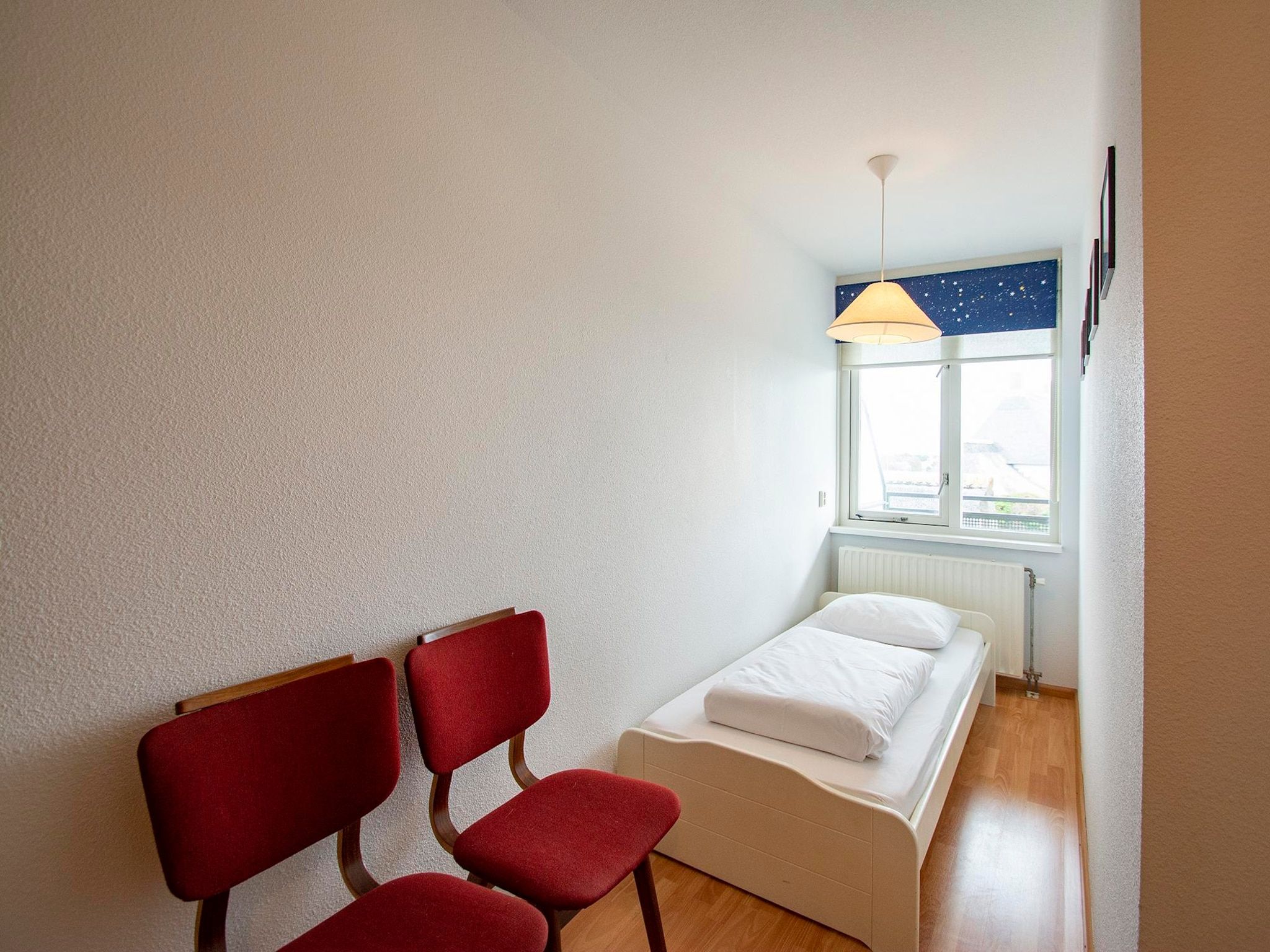 Een slaapkamer van Wijde Blick 203 in Callantsoog