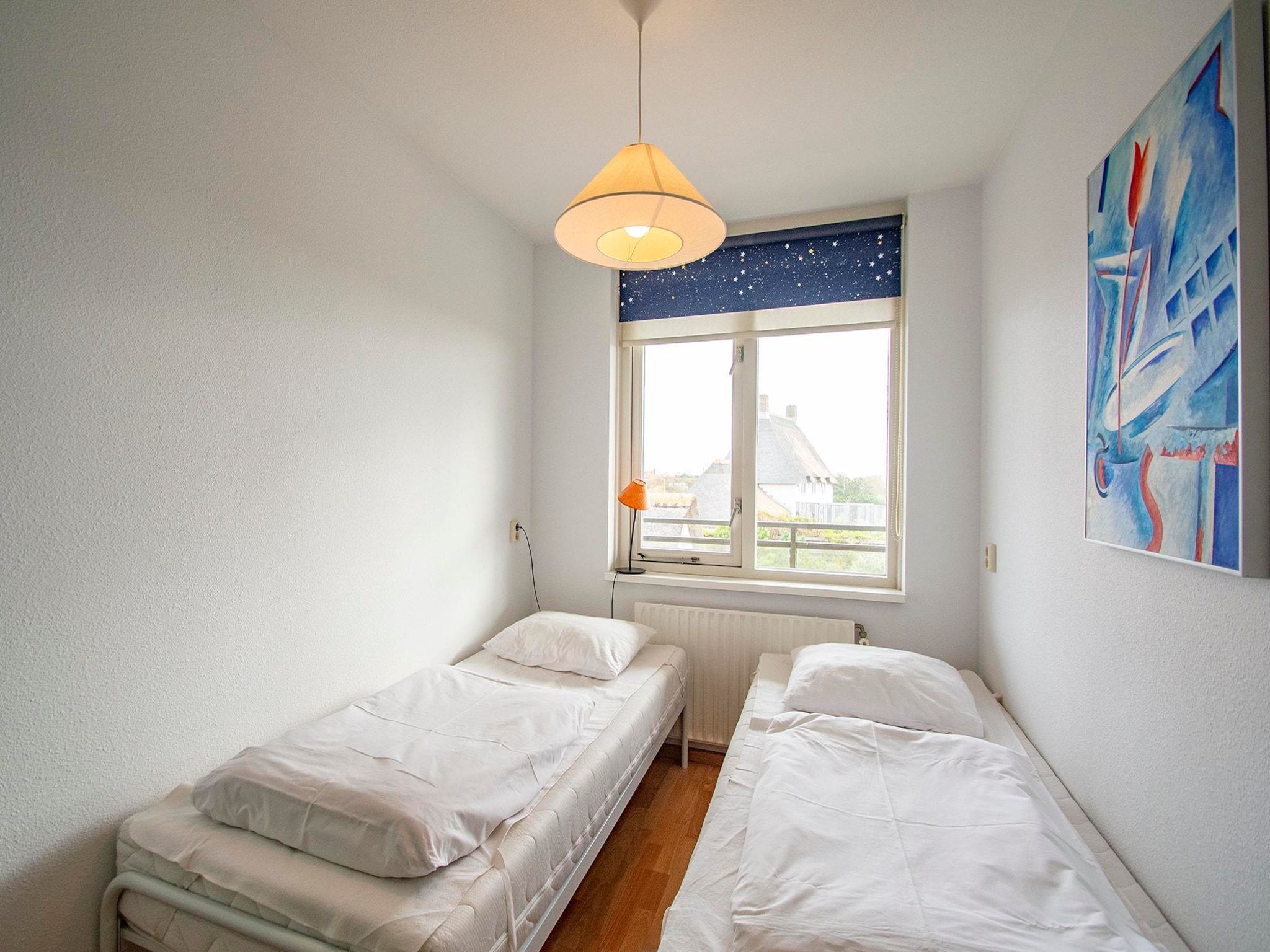 Een slaapkamer van Wijde Blick 203 in Callantsoog