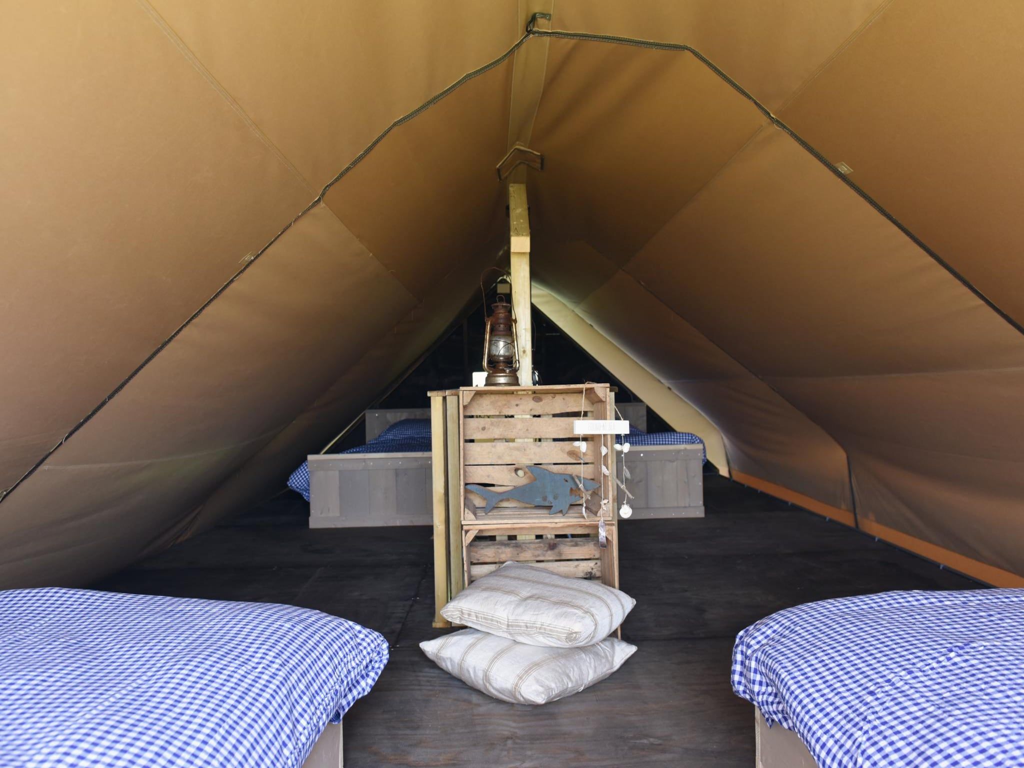 Een slaapkamer van Beach Lodge Groot - Duynpark in Callantsoog