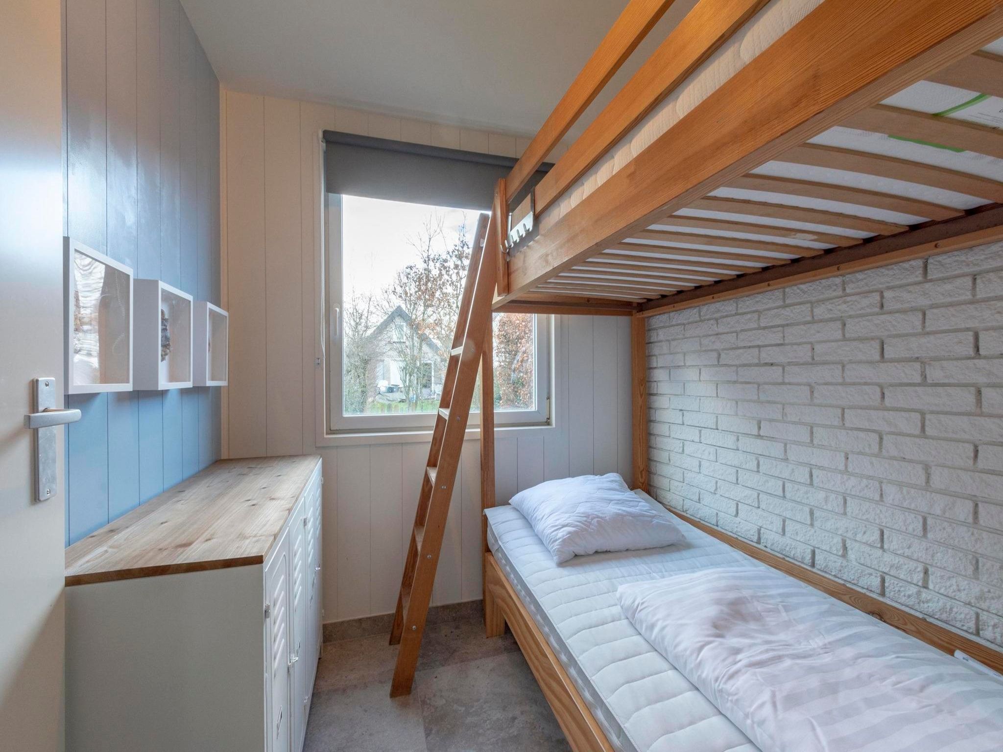 Een slaapkamer van Belkmerduinen 12 in Sint Maartenszee