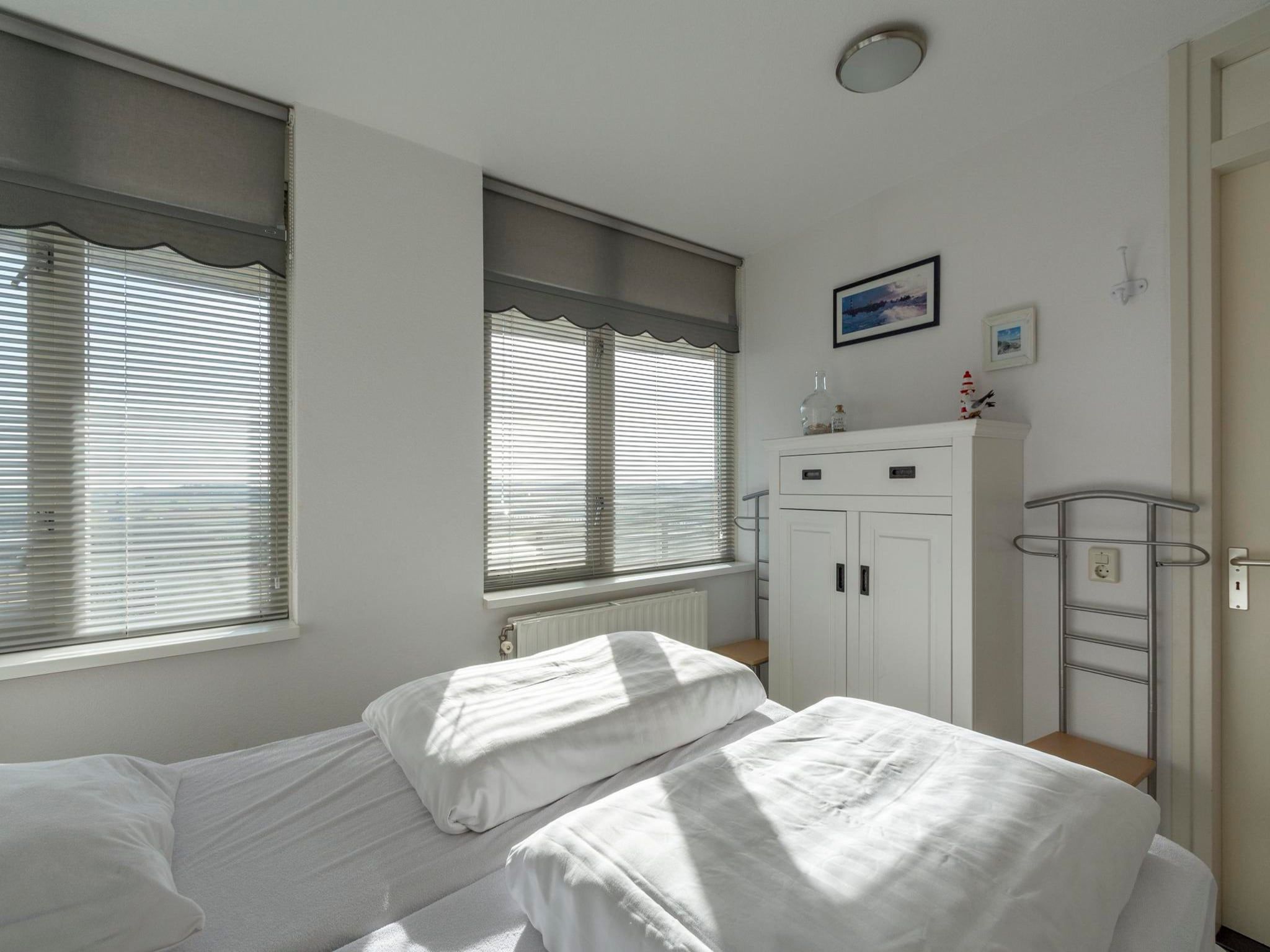 Een slaapkamer van Wijde Blick 205 in Callantsoog